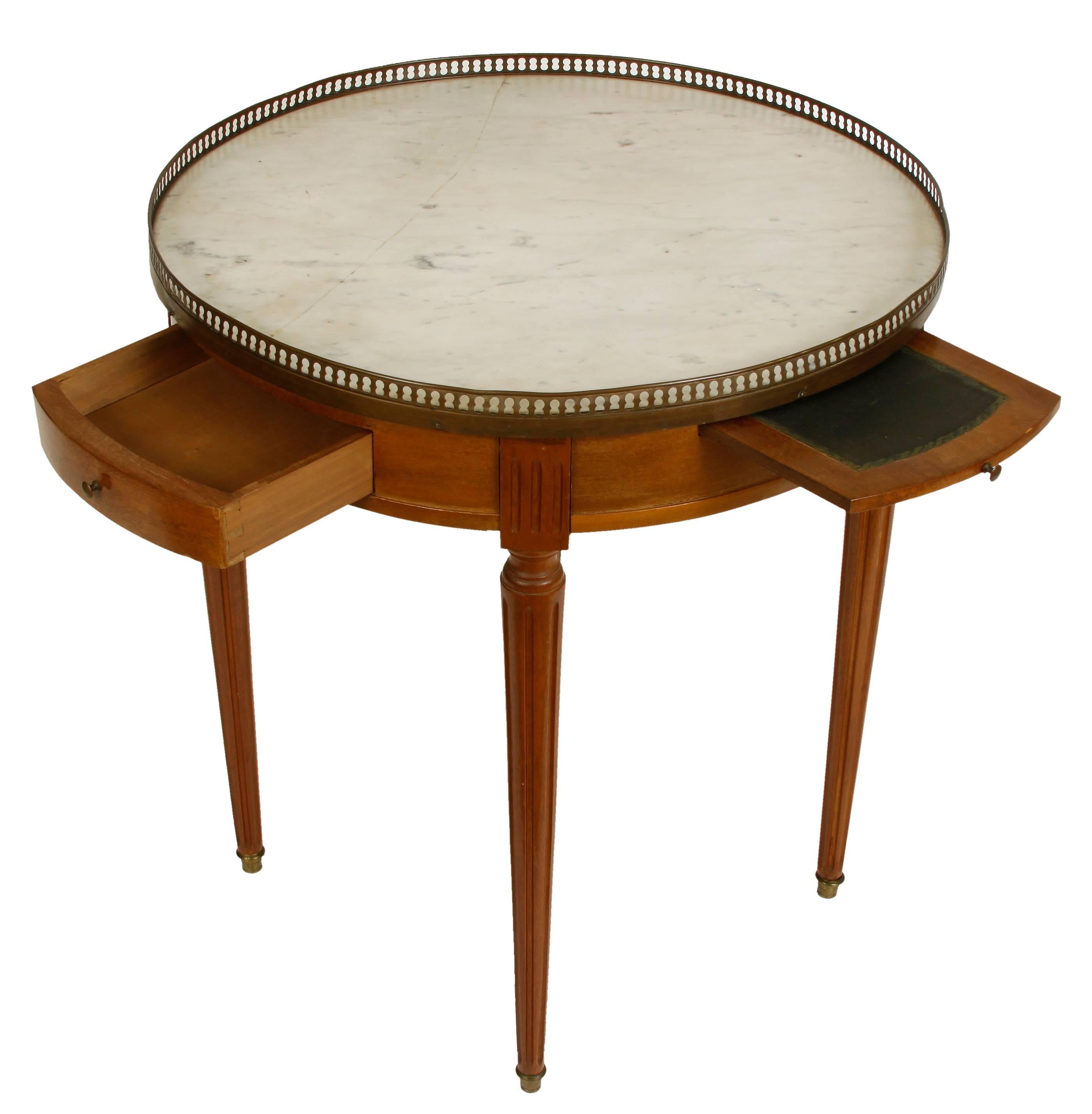 French Bouillotte table with white marble top and reticulated brass gallery edge.