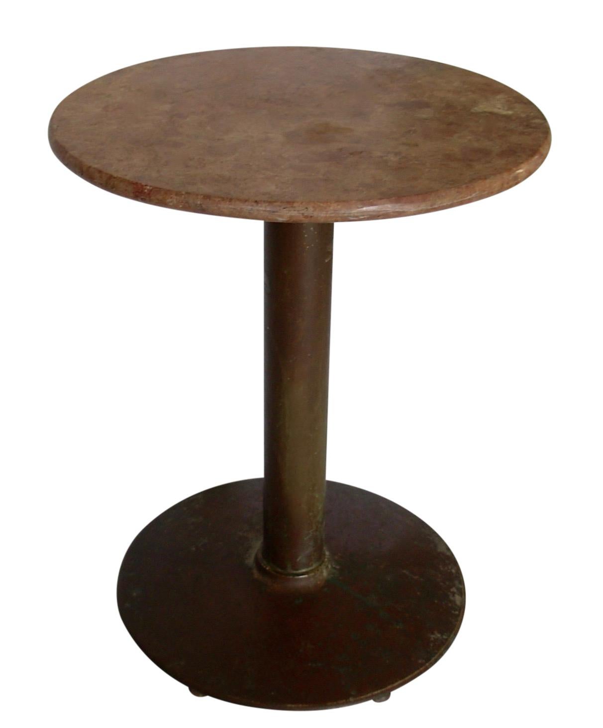 Antique marble top cafe table with a copper flashed steel base and rouge marble top.  French, Early to Mid 20th. Century.
