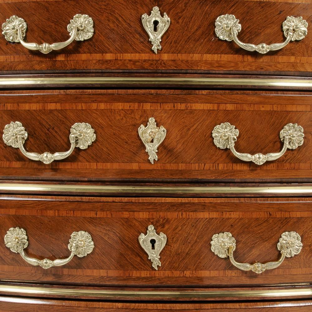 A top-quality French, inlaid rosewood-and-kingwood, marble-top, four-drawer commode with gilt mounts, circa 1880.

 