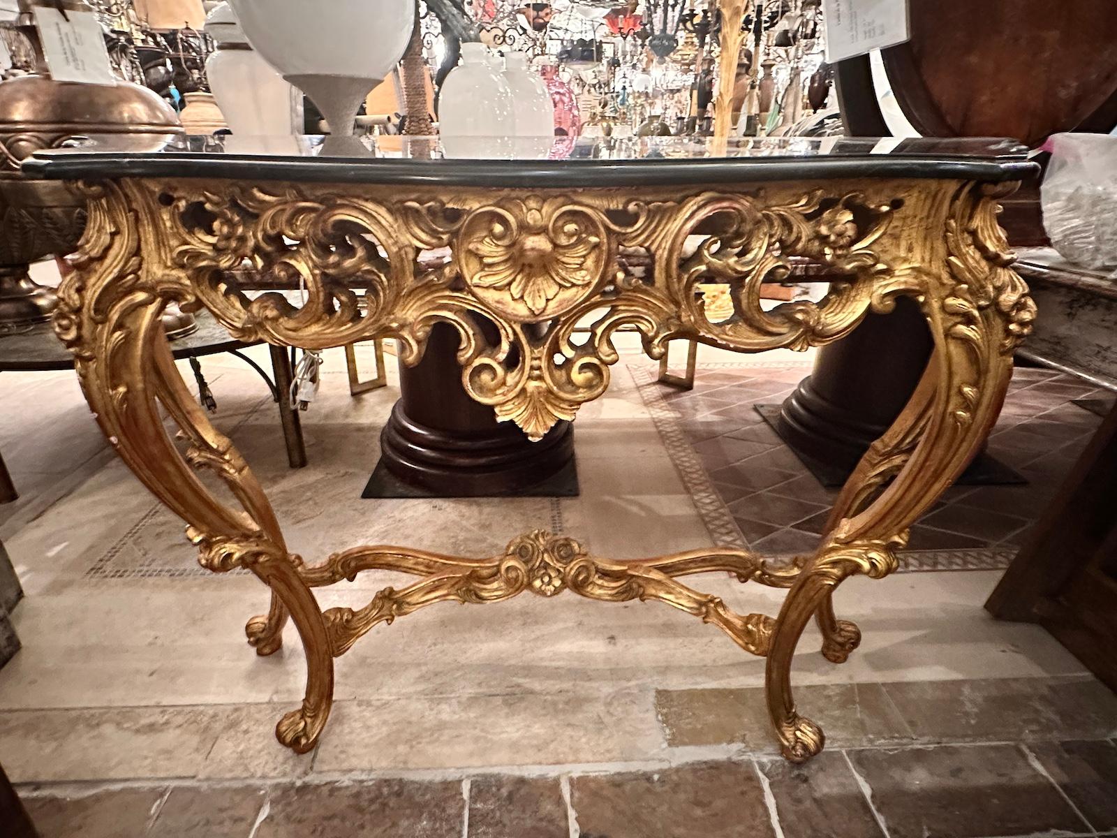 A circa 1950's French gilt wood and marble top console.

Measurements:
Height: 35.5