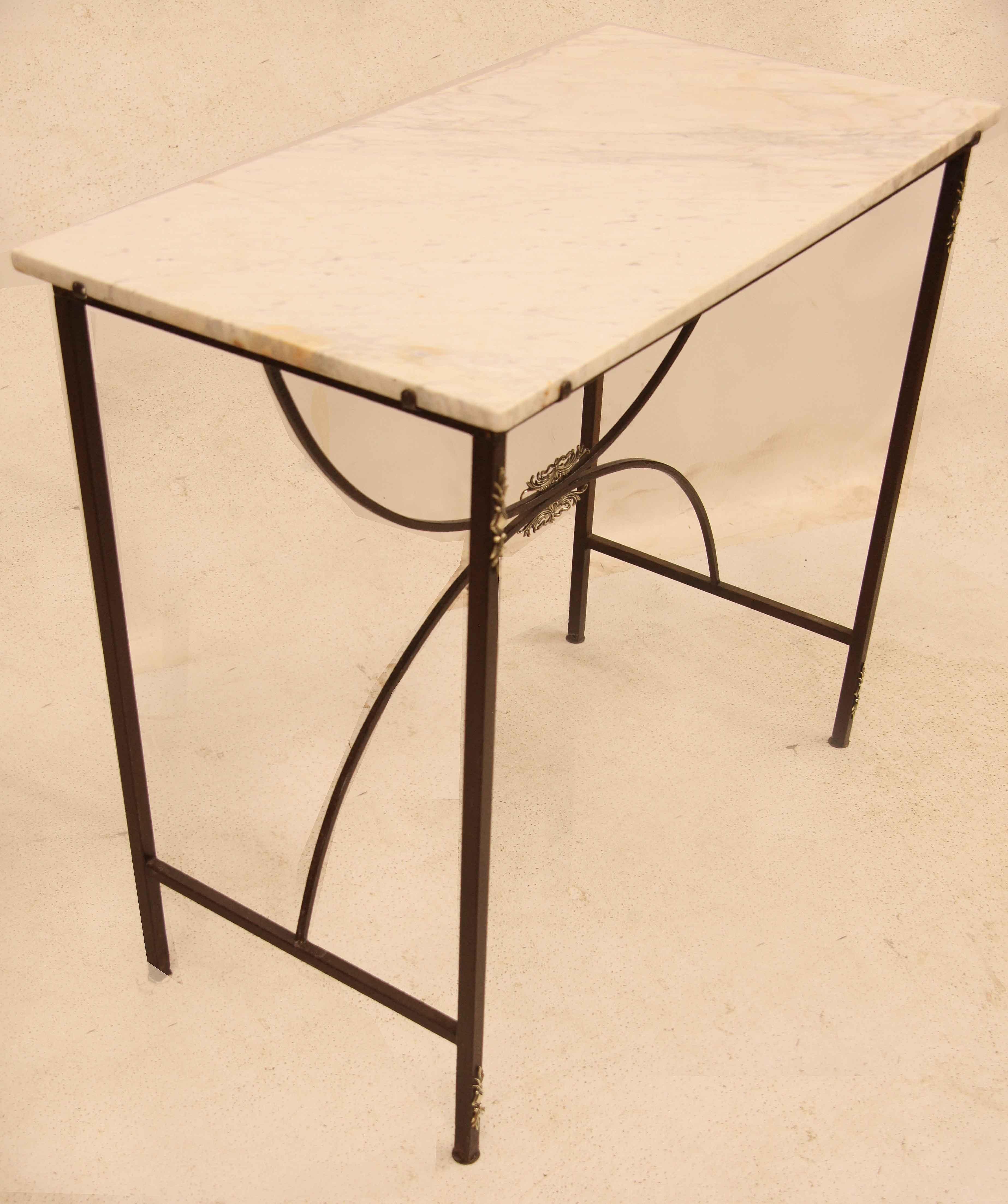 French marble console table,  the white marble with gray veining originally had a gallery around the sides and back. The front legs have brass appliques at the top and bottom .  There are stretchers supporting each side and demi-lune stretchers
