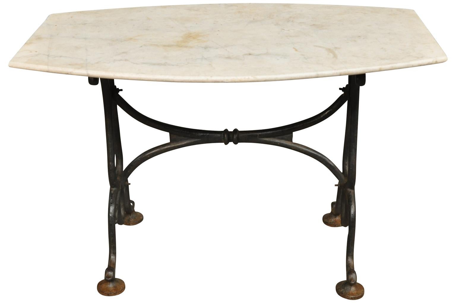 A very lovely 19th century garden table, console from the Provence region of France. Soundly constructed with a painted cast iron base with its beautifully patina'd marble top. A perfect table for any interior of exterior.