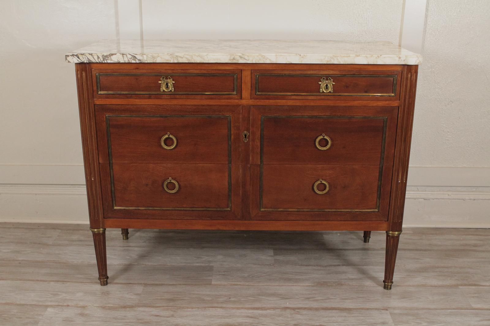 French marble-top mahogany brass inlaid console/cabinet, circa mid-20th century.
Dimensions 34.5