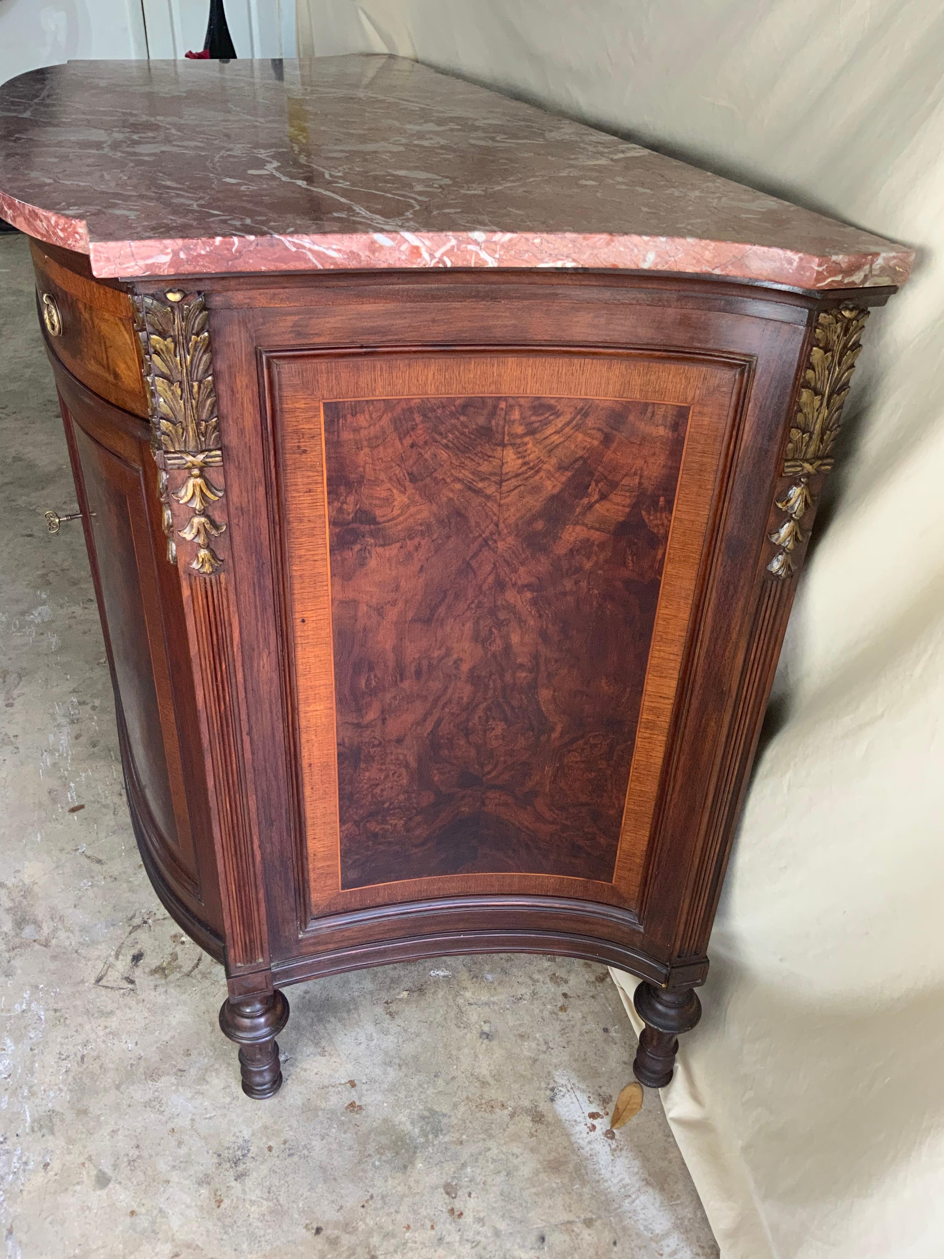 A very nice late 19th century French Marble Top Walnut Server or Linen Press. This is a beautiful piece with Pink Rouge marble and gilt leaf carvings on the concave and rear corners of the case. Nicely decorated burl Walnut case with inlays and