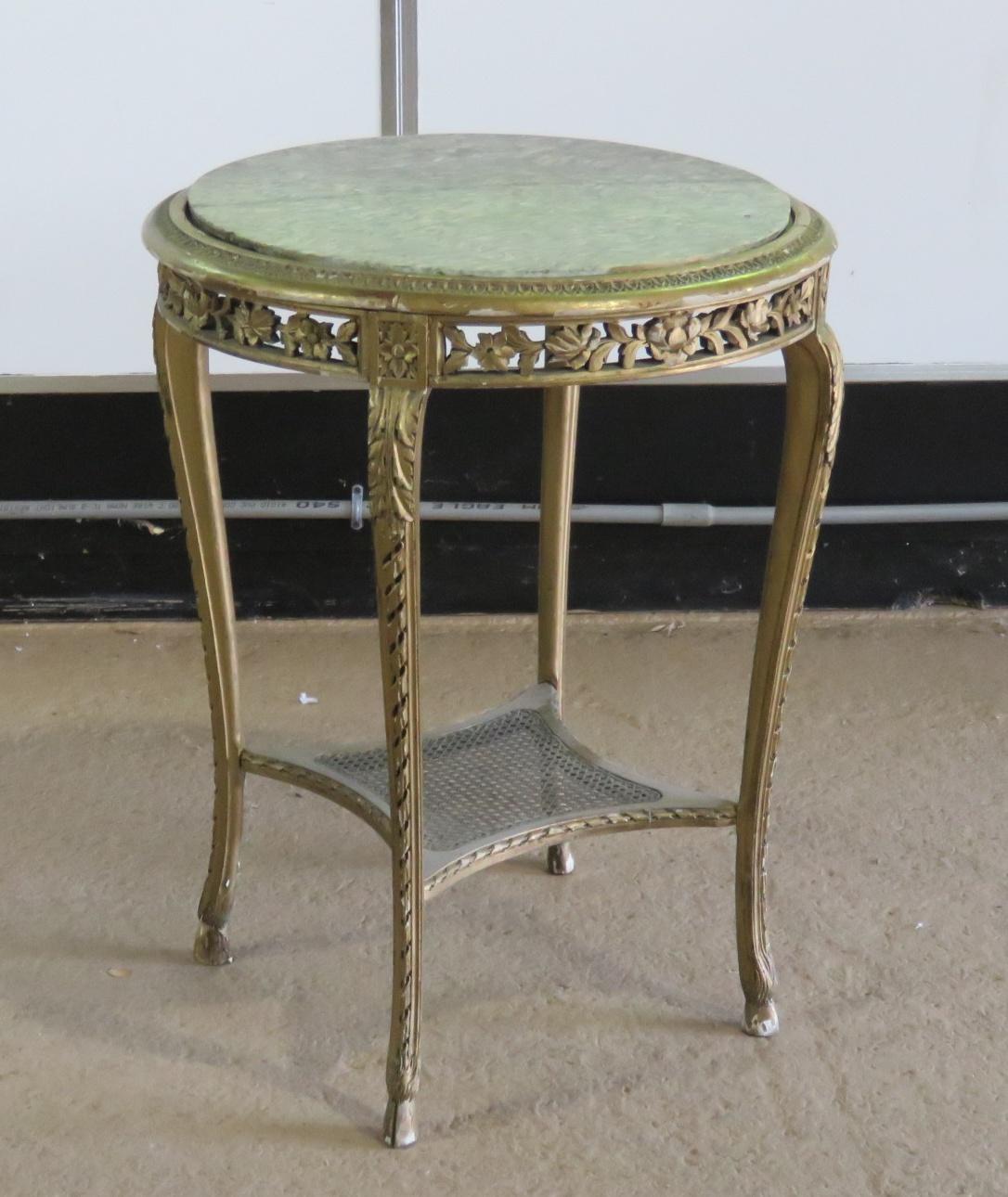 French marble top gilt paint decorated side table with a caned shelf on the bottom.