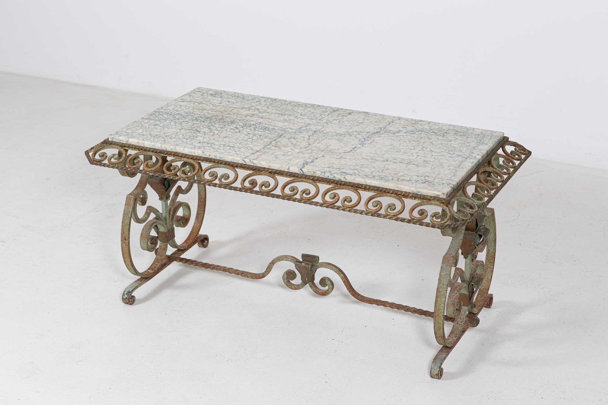 Circa 1940.

French marble & wrought iron coffee table

In the style of the productions of the same period of Gilbert Poillerat

Sourced form the South of France

  

Measures: W104 x D61 x H56 cm.