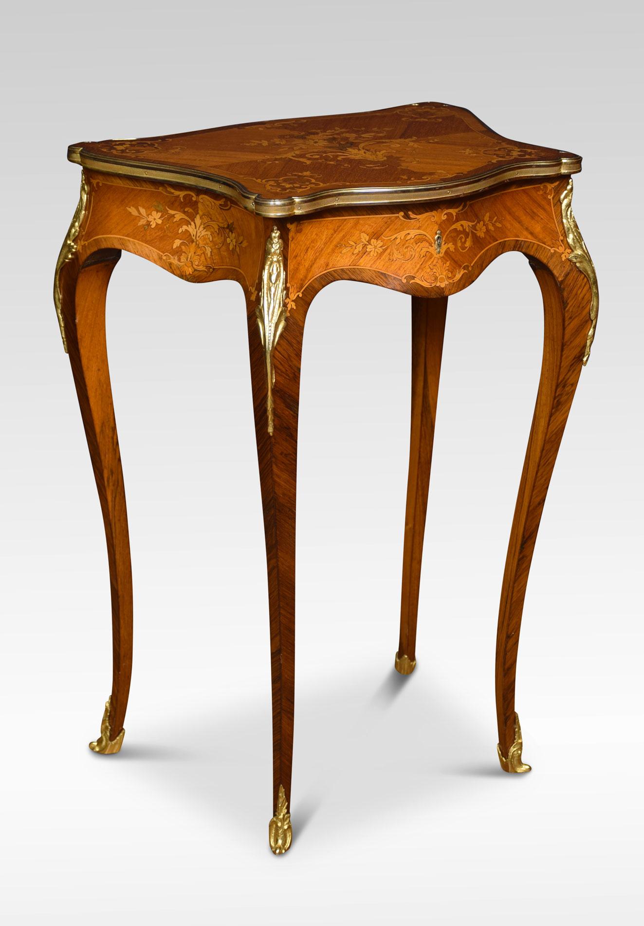 French marquetry dressing table with shaped lift up top inlaid with floral marquetry, and enclosed in brass rim. The top opening to reveal the upholstered interior. All raise upon four slender cabriole supports.
Dimensions:
Height 30 inches
Width