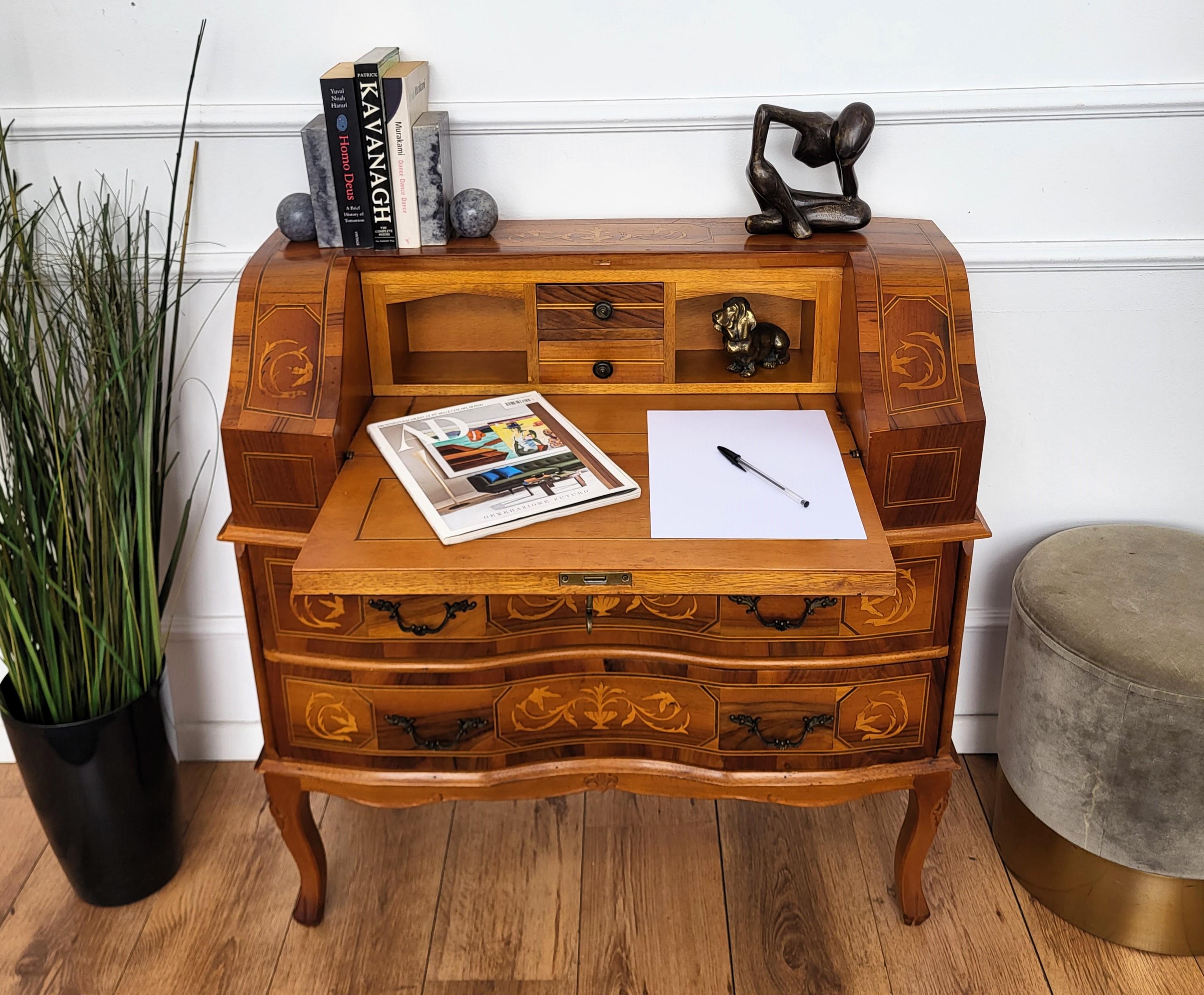Very elegant French secretary desk, writing table, with slant drop front and bottom drawers, with the beautiful inlay decors in classic figures all around the piece. When opened we find the writing area and two drawers. This beautiful piece is