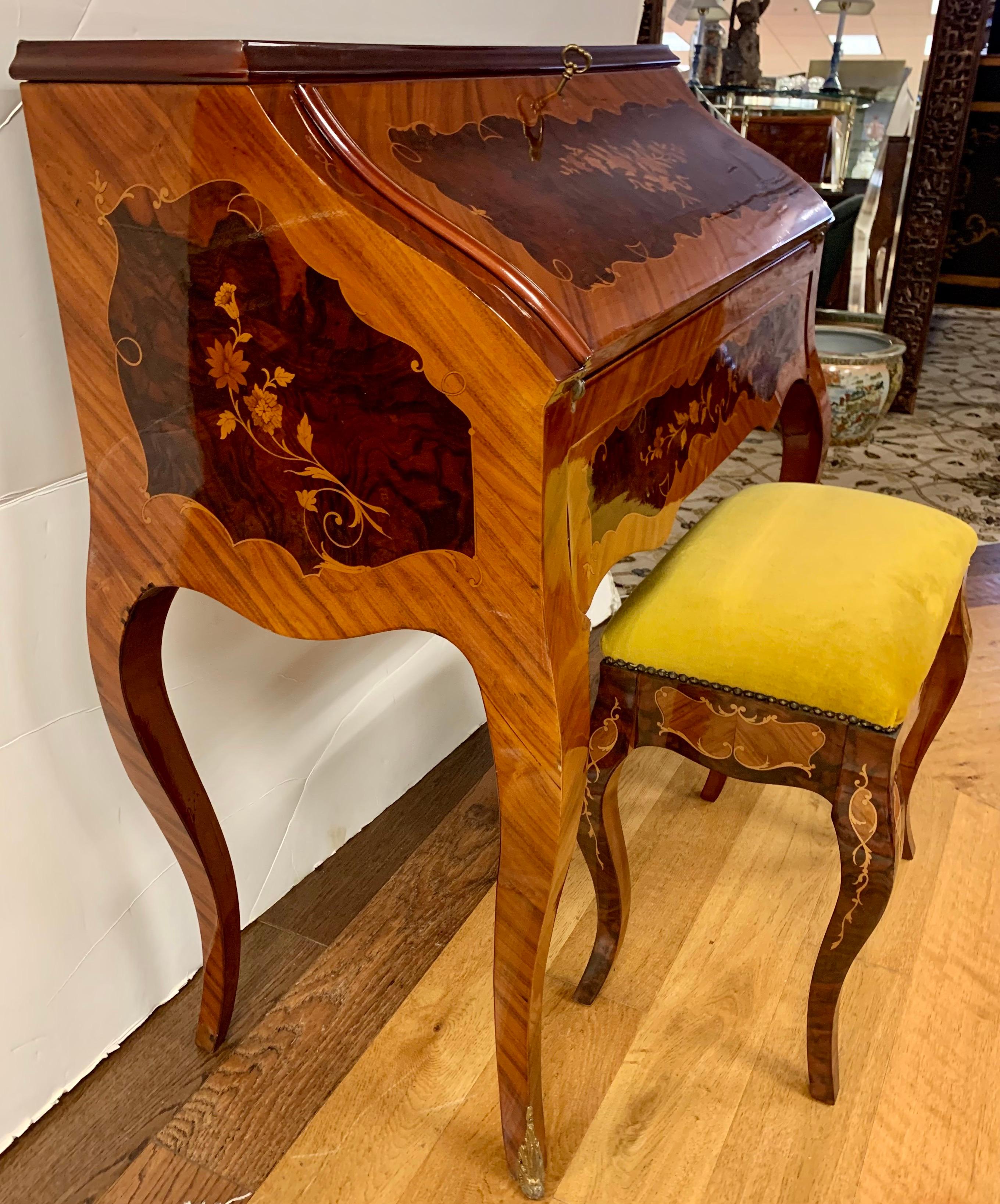 Gorgeous French writing desk in kingwood with intricate marquetry inlay work on all sides, amazing floral motifs and arabesques. Writing surface is revealed via drop down with cubby and three small drawers. Comes with velvet top bench with same