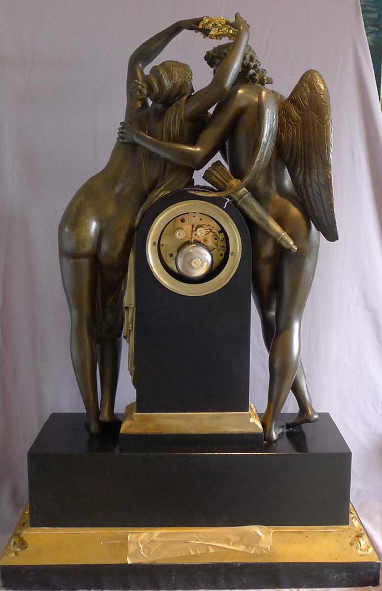 French massive mantel clock of Psyche and Cupid signed Deniere. Superb example after the original late 18th century model by Claud Michalon. This version was made by the famous early 19th century bronzier Deniere. These fabulous and sexy bronzes are