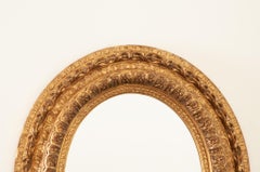 Specchio ovale massiccio francese in legno dorato di Napoleone III