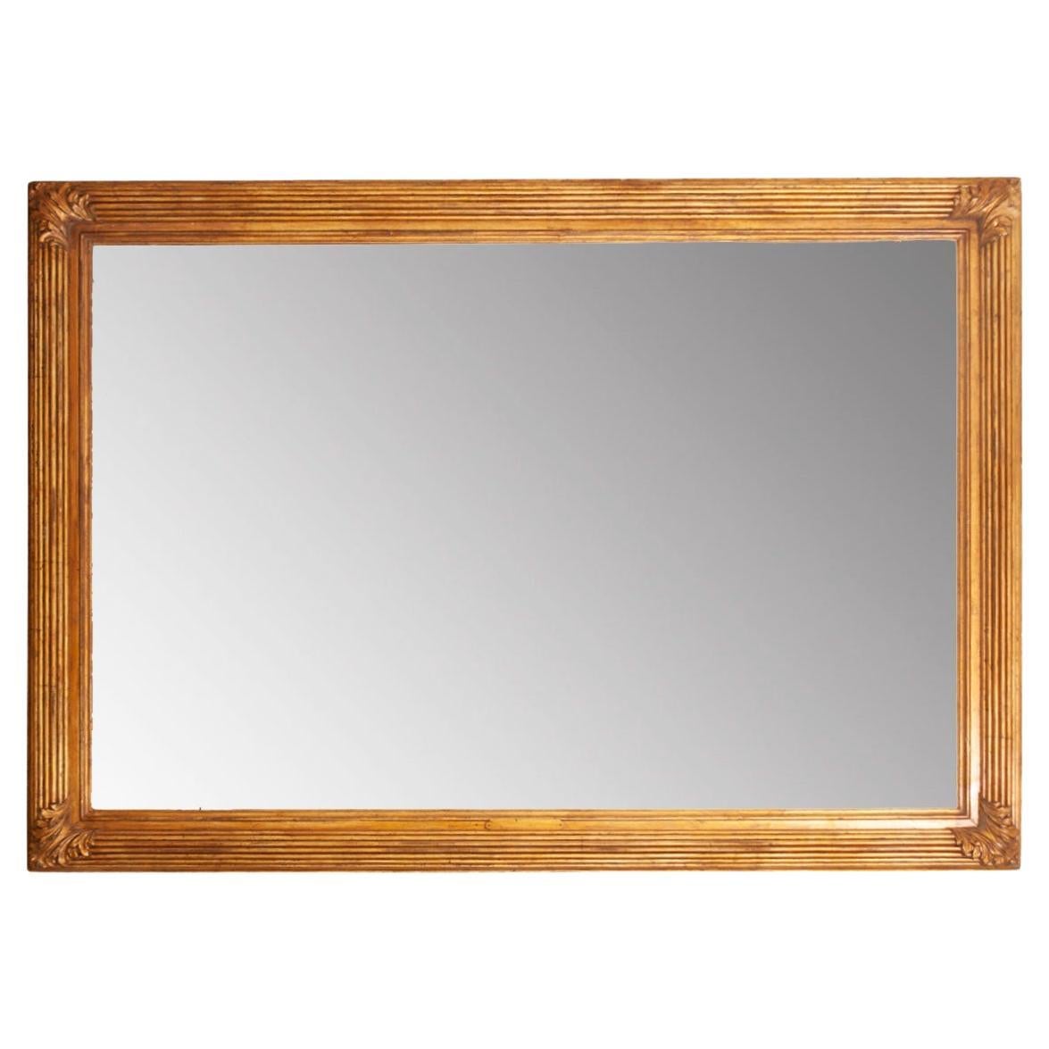 Miroir massif français encadré peint en or en vente