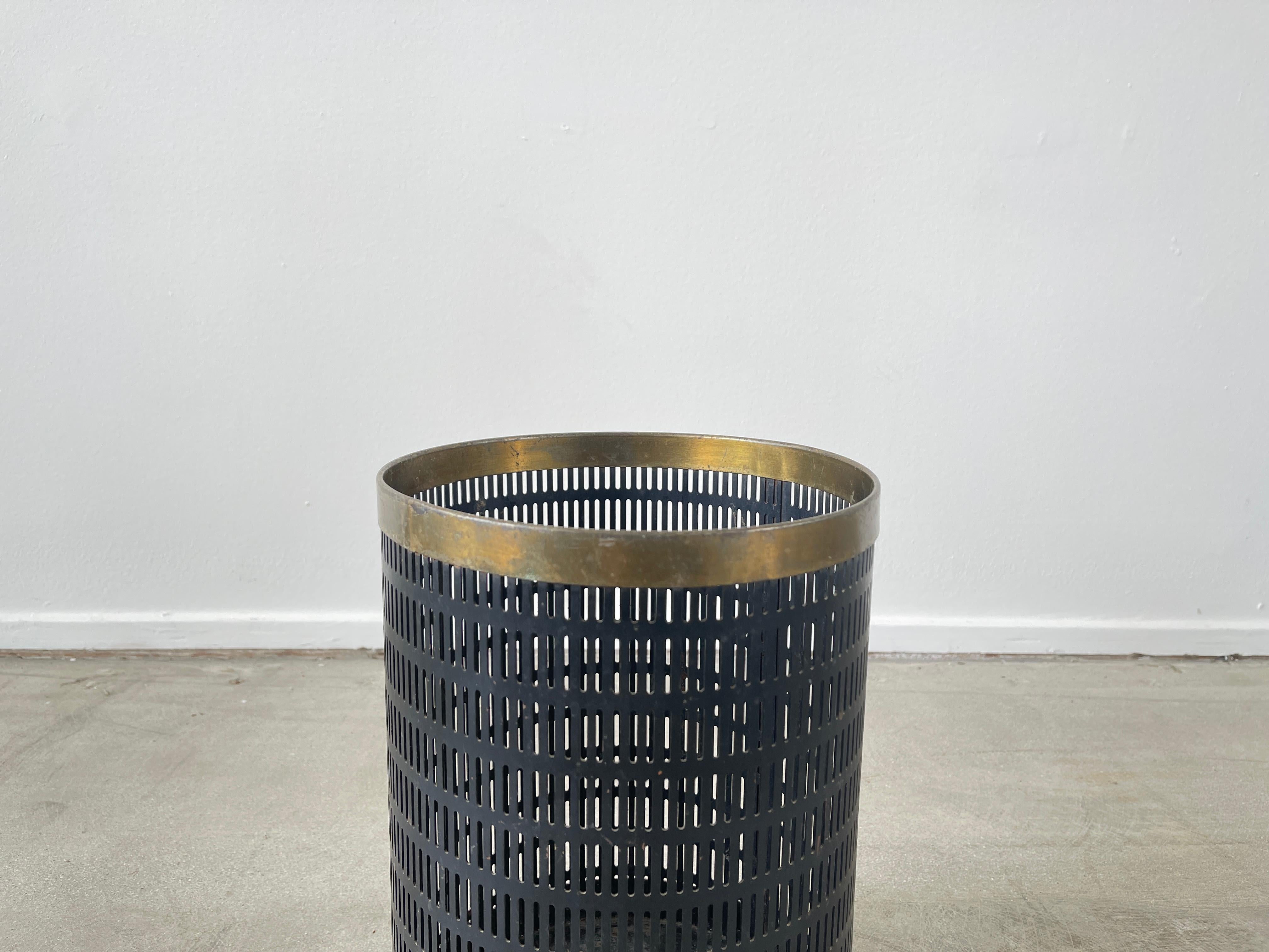 Great trash bin in the style of Mathieu Matégot
Perforated metal with brass rimed top.