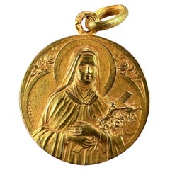 Mazzoni, breloque médaille St Therese en or jaune 18 carats