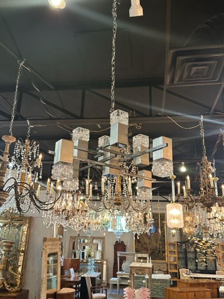 Interesting French MCM nickle and glass 8 light suspension chandelier.  Very fine quality and perfect for a modern home. Beautiful!!