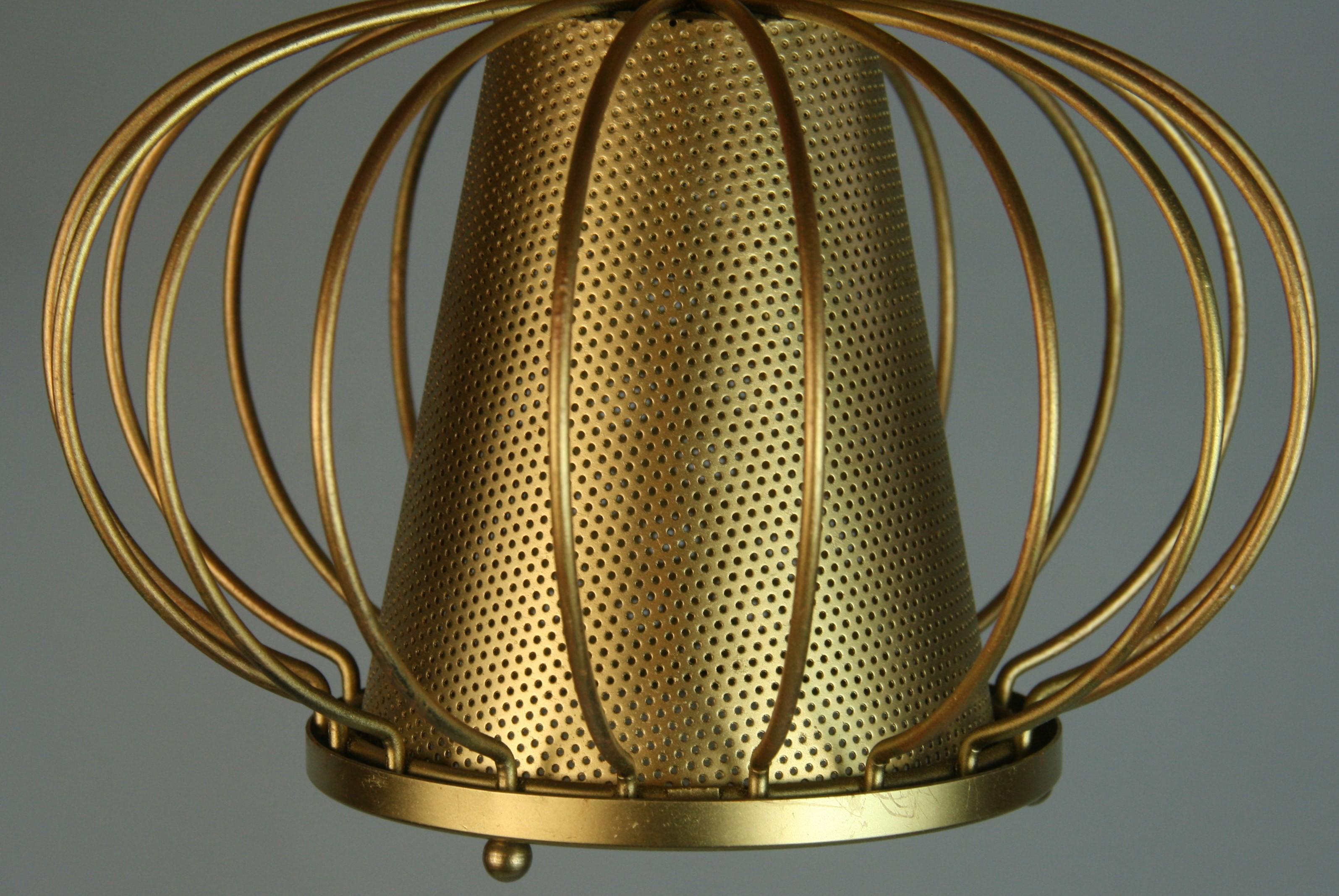1600 French  brass perforated cone center ending with a frosted glass lenses set in a gilt ribbed metal frame. One Edison based bulb 75 watt. 
Presently a flush mount can be converted to chain hung pendant
2 pieces available priced individually