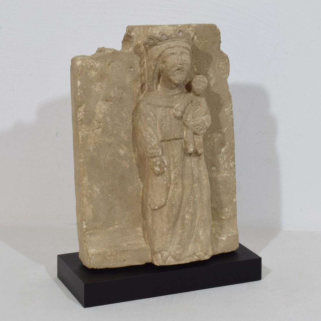Hand-Carved French Medieval Carved Stone Panel Depicting A Madonna With Child For Sale