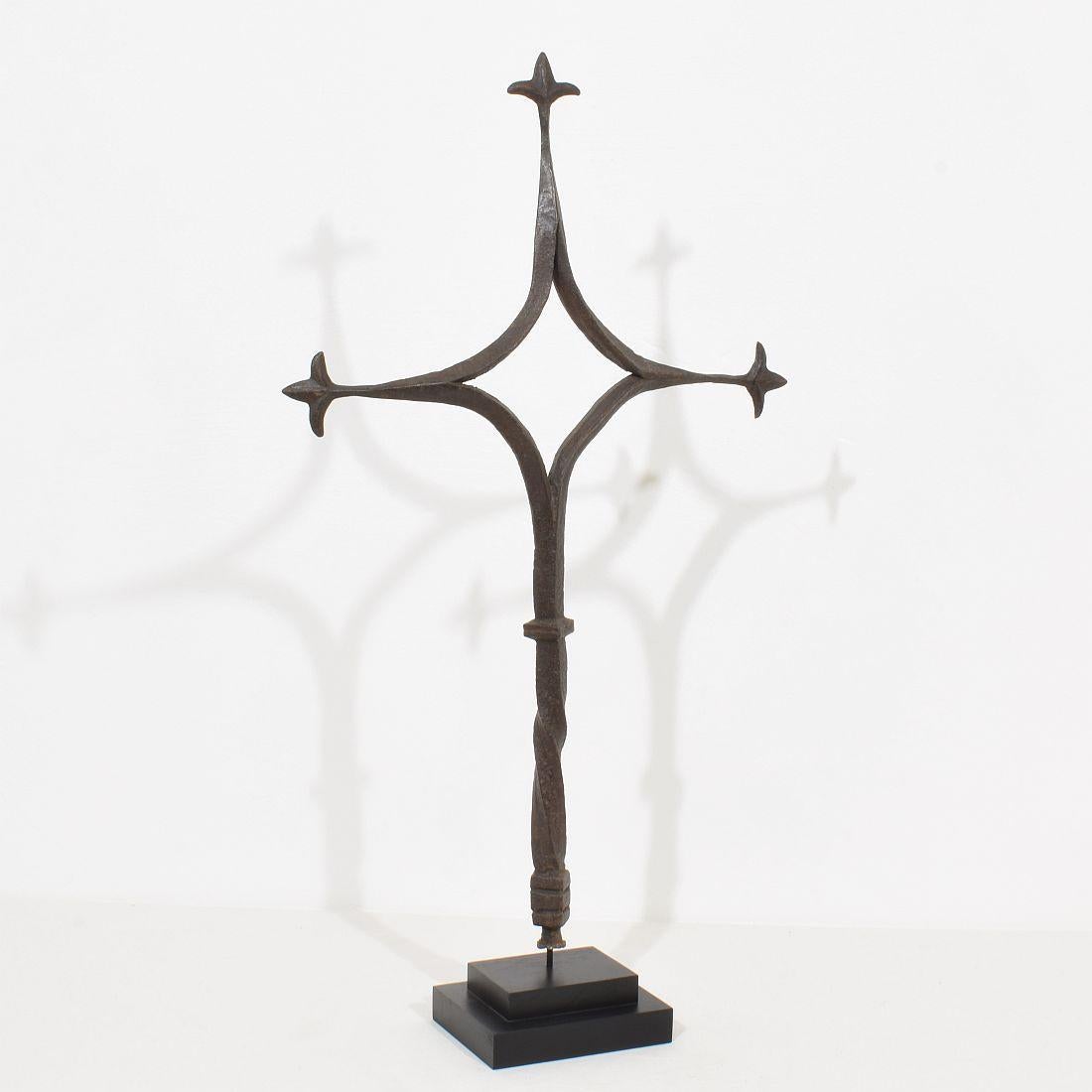 Unique hand forged iron cross that once stood in the centre of a Provençal village.
France, circa 1450-1550. Weathered.
Measurement is with the wooden base.