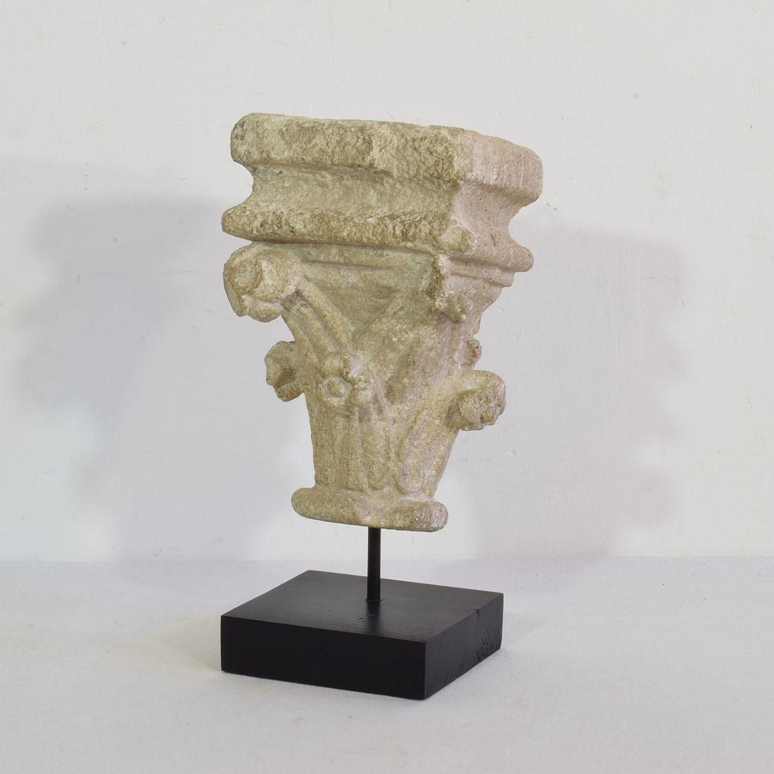 Rare and beautiful small medieval treasure.
Hand carved Romanesque stone capital,
France, circa 1250-1400.
Weathered, small losses.
Now placed on a wooden pedestal. The item once also got a small a hook to hang it on the wall.