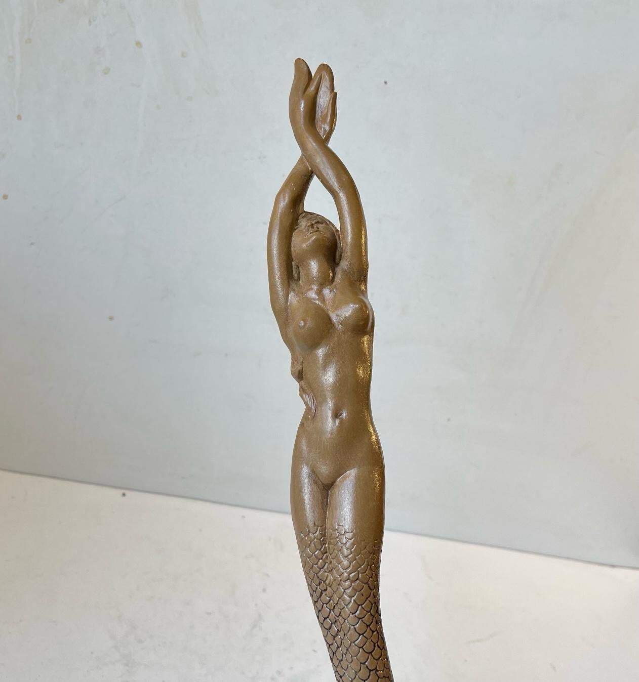 Elongated stylish mermaid shoe horn. It was cast and made in France during the 1940s or 50s. Its made from Galalith which is a type of bakelite usually used for jewelry and buttons. Imprinted to its back: Made in France. Measurements: H: 50 cm, W: