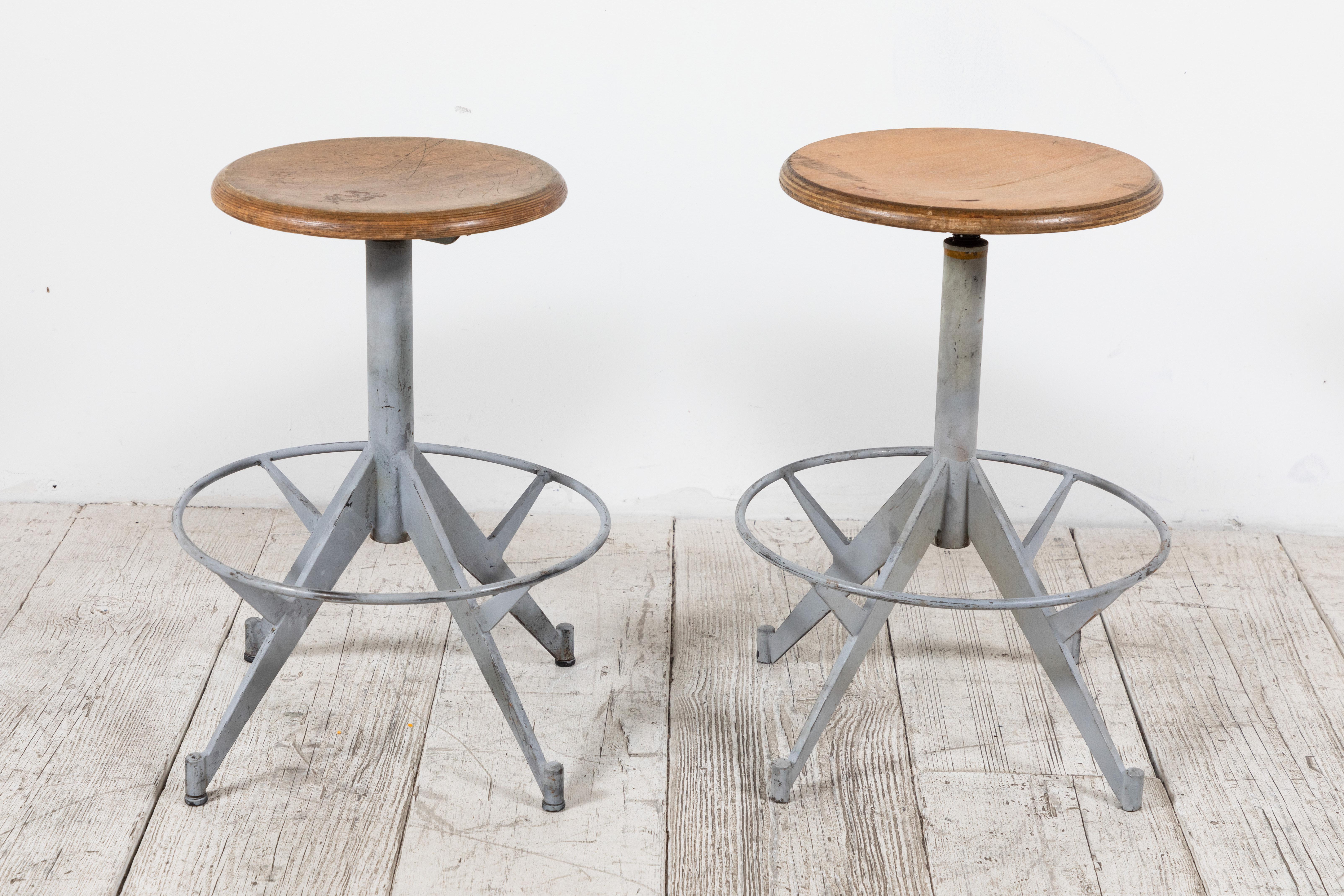 French metal swivel stool with wood top.