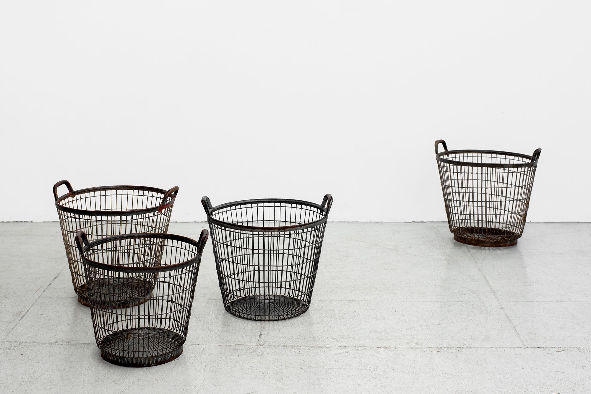 French cage style baskets in heavy black iron with beautiful patina. 
Sold and priced individually. 
Four available.

Measures: Basket #1
Diameter 17”
Height 17” 

Basket #2
Diameter17”
Height 16 1/4”

Basket #3
Diameter 17 1/2”
Height