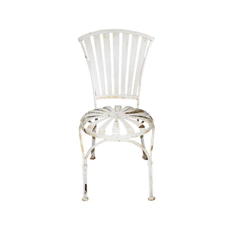 A 1930s Art Deco style iconic metal patio chair by Francois Carre. The chair features a 