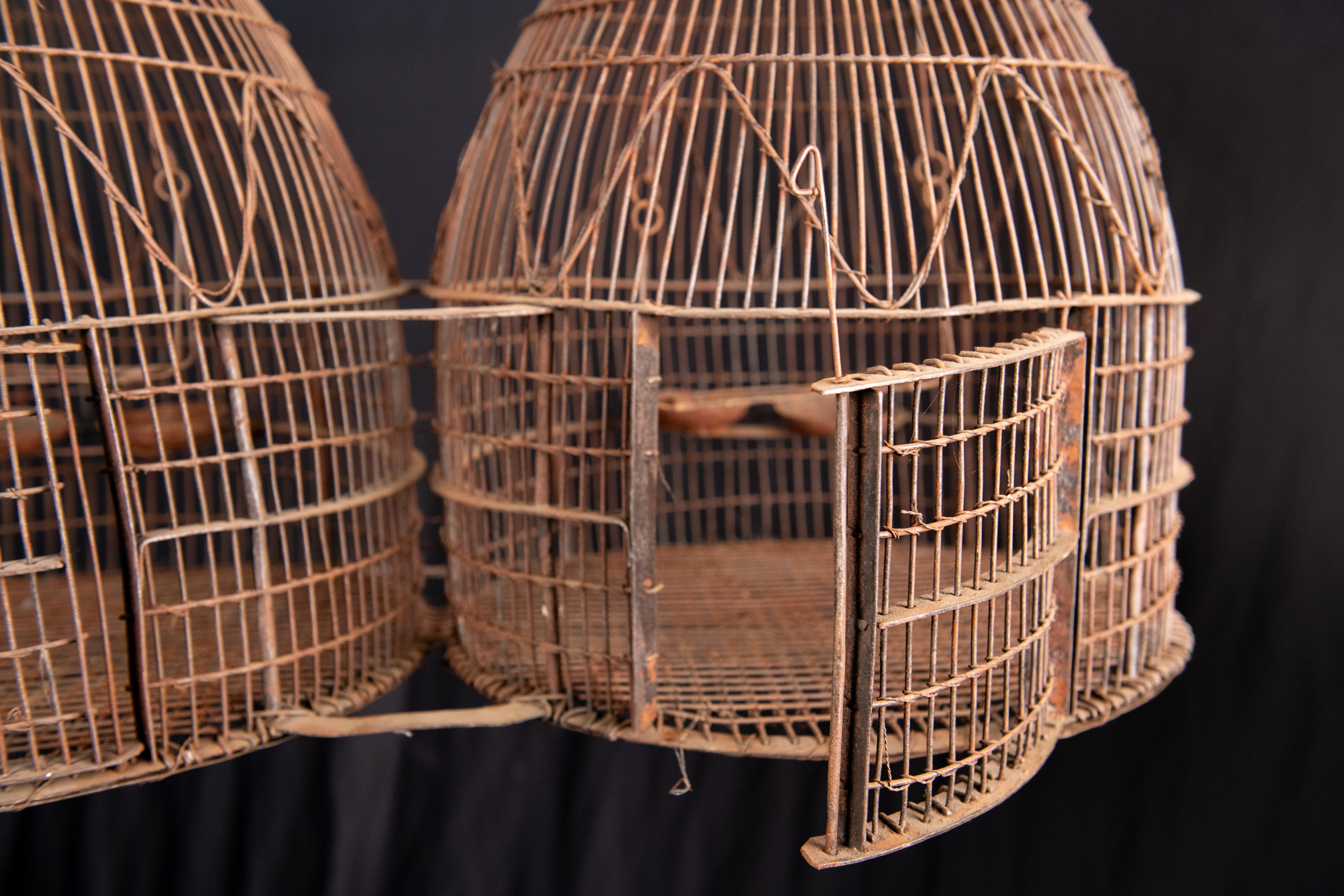 Vintage French Double Dome Bird Cage. This Double Beehive Dome Wirework Bird Cage was most probably used to sell birds in the open markets of Paris. they can still be used for bird and are beautiful for display and for plant arrangements.

Hand made