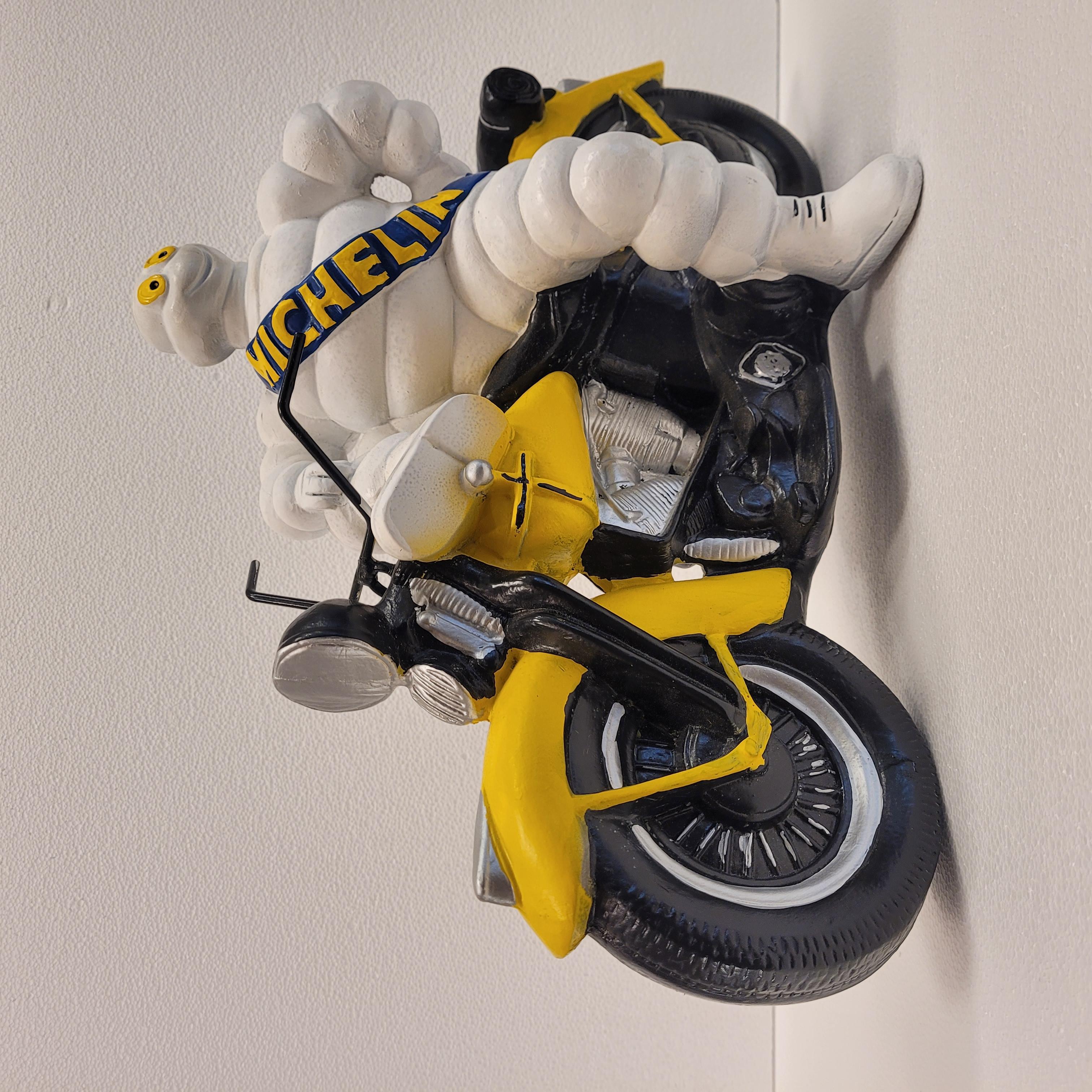 French Michelin Doll or Bibendum with motorcycle , resin 9