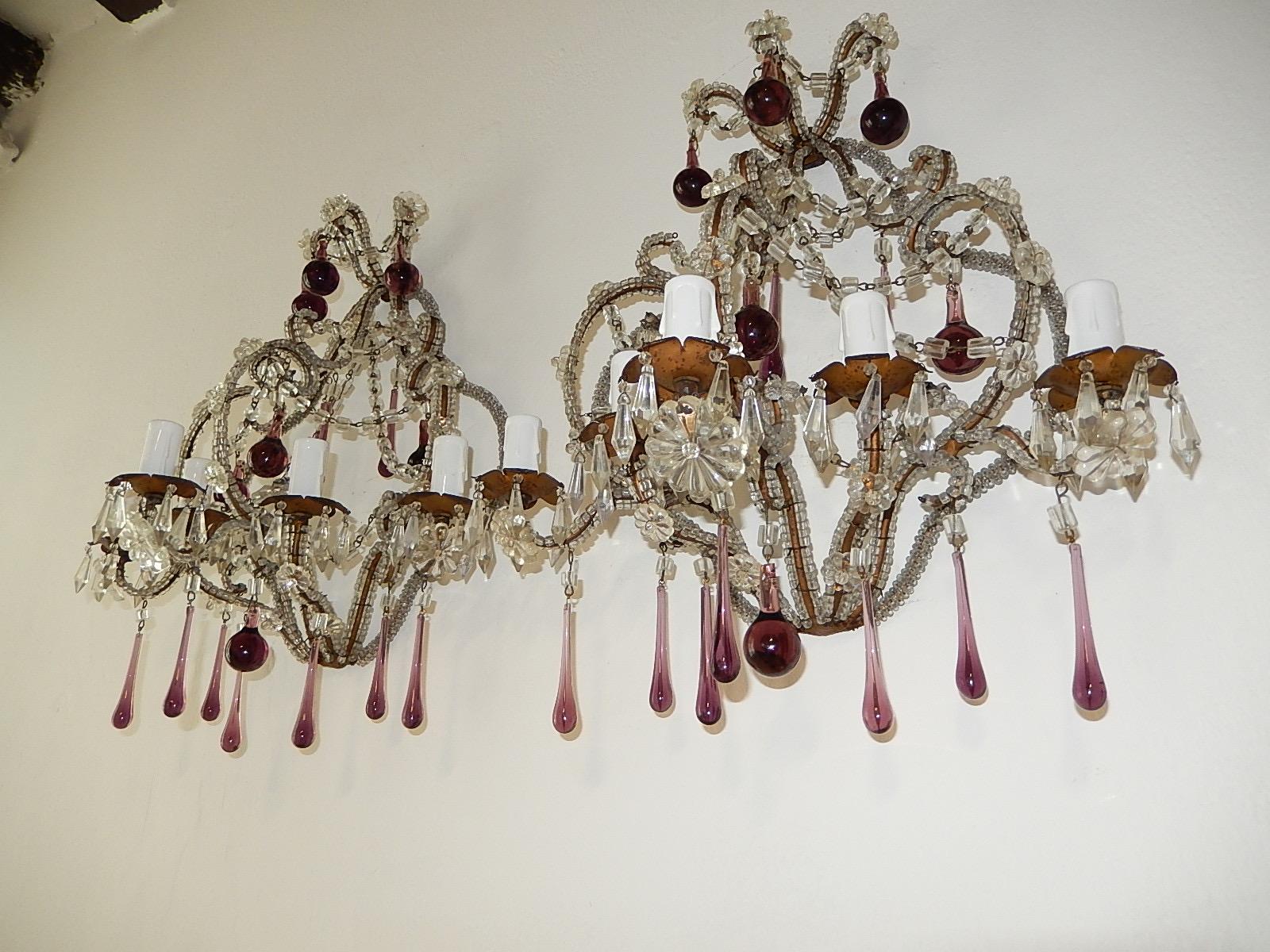 Housing five lights each with small vintage crystals dripping from each. Macaroni and micro beading throughout. Also, crystal swags and florets throughout. Adorning skinny and rare bulbous amethyst Murano drops. Will be newly rewired with certified