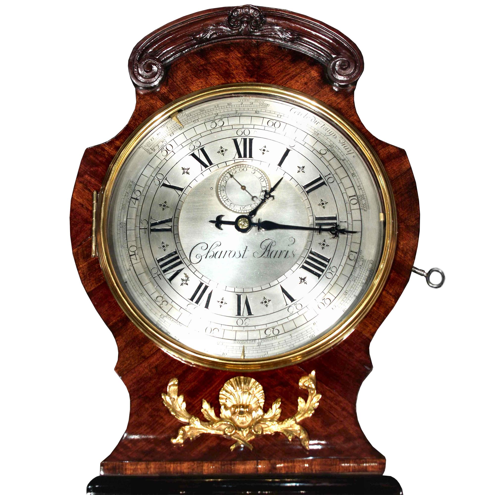 A sensational French Louis XV period, circa 1740, tall case clock with an extremely rare mechanism movement signed Jean Charost. The original case in kingwood, ebony and rosewood veneer is highly decorated by impressive ormolu mounts with a female