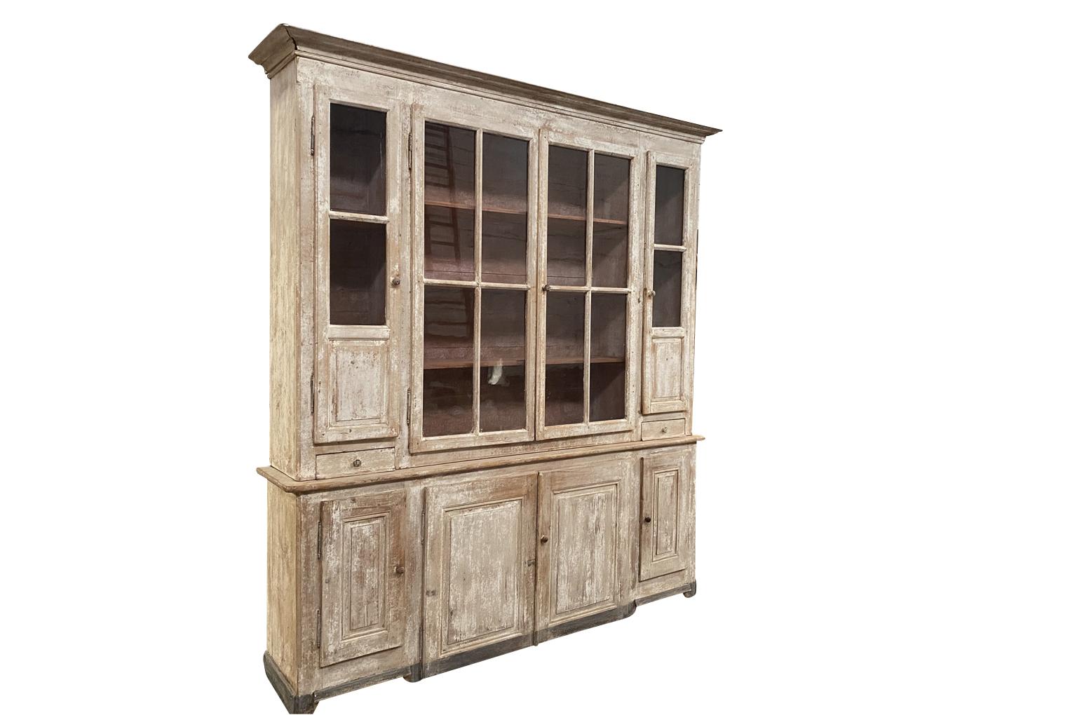 A very handsome mid-19th century buffet deux corps from the Provence region of France. Soundly constructed with 8 doors, 2 drawers and interior shelves. A wonderful cabinet for display and storage. Terrific patina.