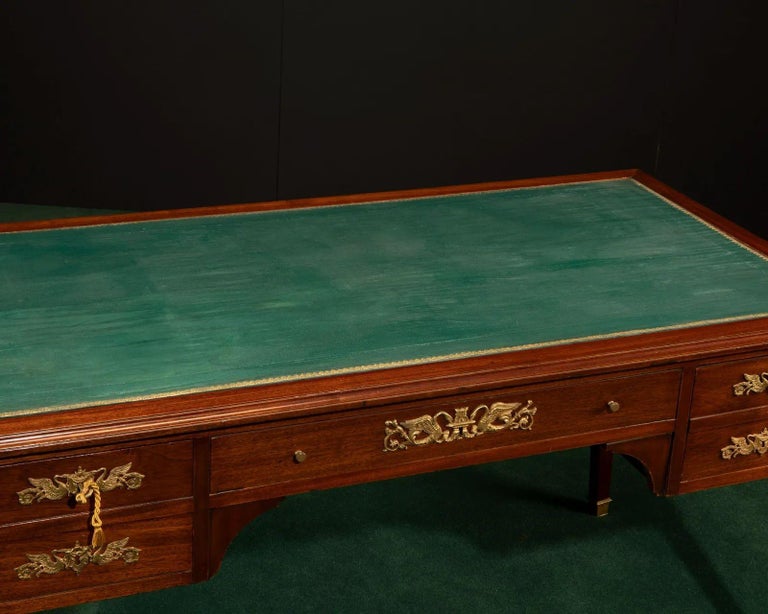 Mid-19th century
 
The petite mahogany knee-hole desk with a central drawer and two slender drawers on each side,
with gilt-bronze mounts and inset tooled green leather writing surface.
 
Dimensions:
 
30.5