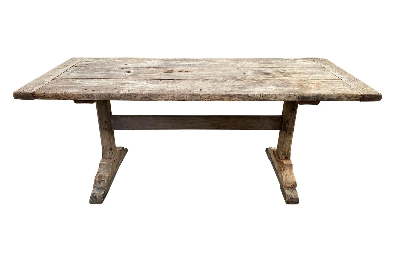 A very handsome mid-19th century farm table - trestle table from the Provence region of France. Soundly constructed from naturally washed oak. Terrific patina. Serves nicely as a writing table as well.