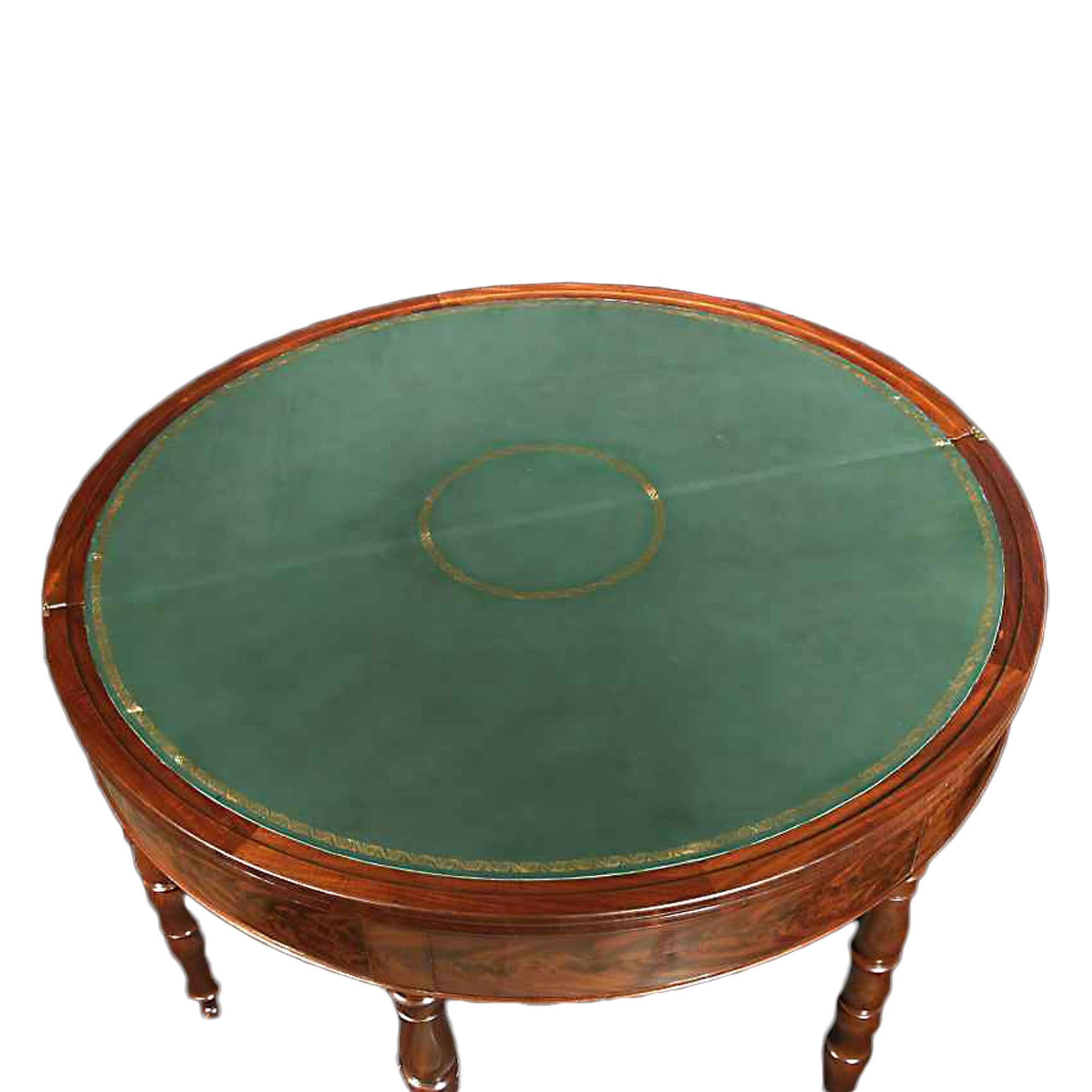 A very handsome French mid-19th century French Charles X style crouch mahogany games table. The table is raised by 5 solid mahogany turned baluster legs. The half round apron and top has an exquisite crouch mahogany inlay with a moulded border. The