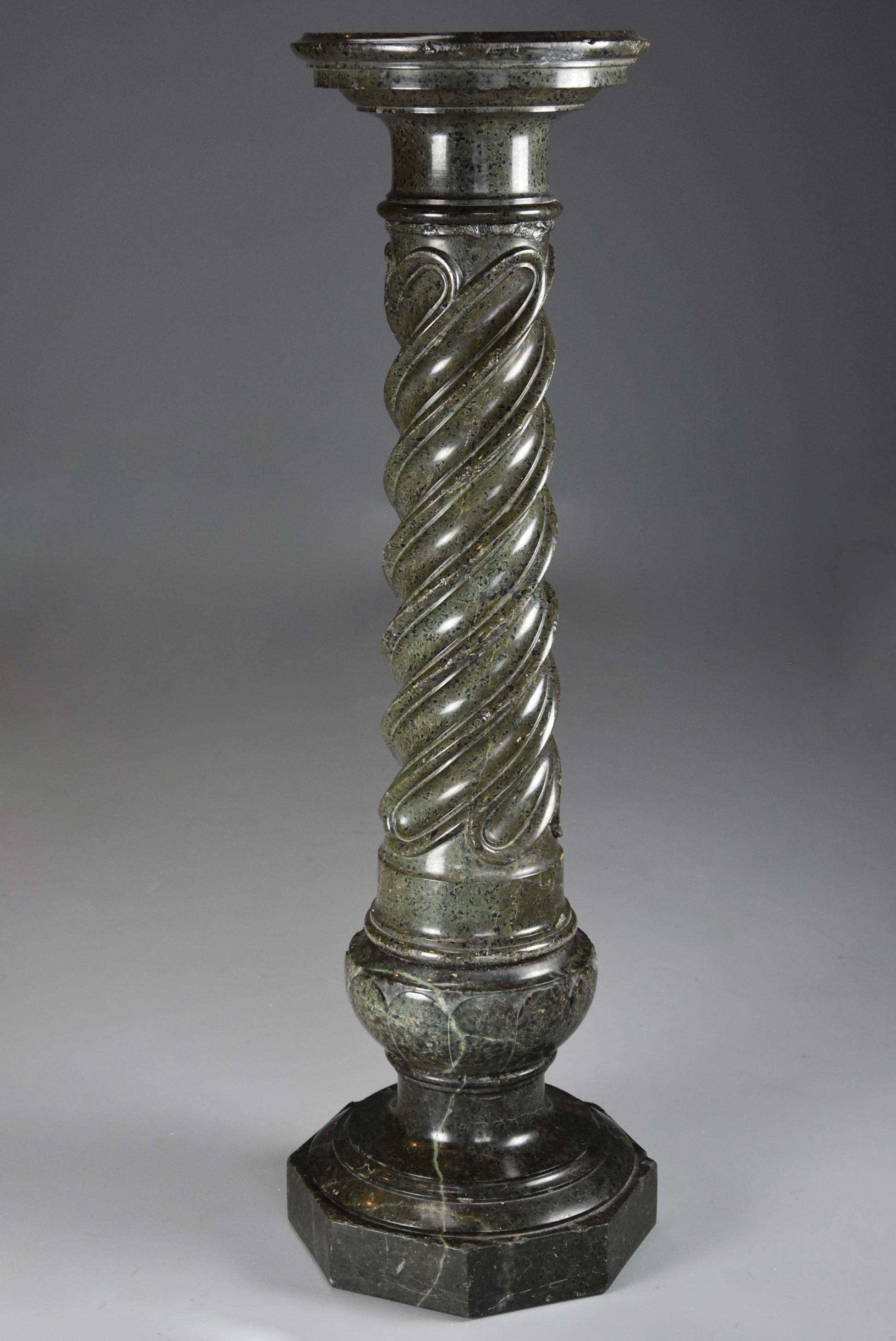 A French mid-19th century green serpentine marble column.

This column consists of a circular turned top with a molded edge with carved spiral twist column below leading down to a baluster support with circular molded edge all supported on an