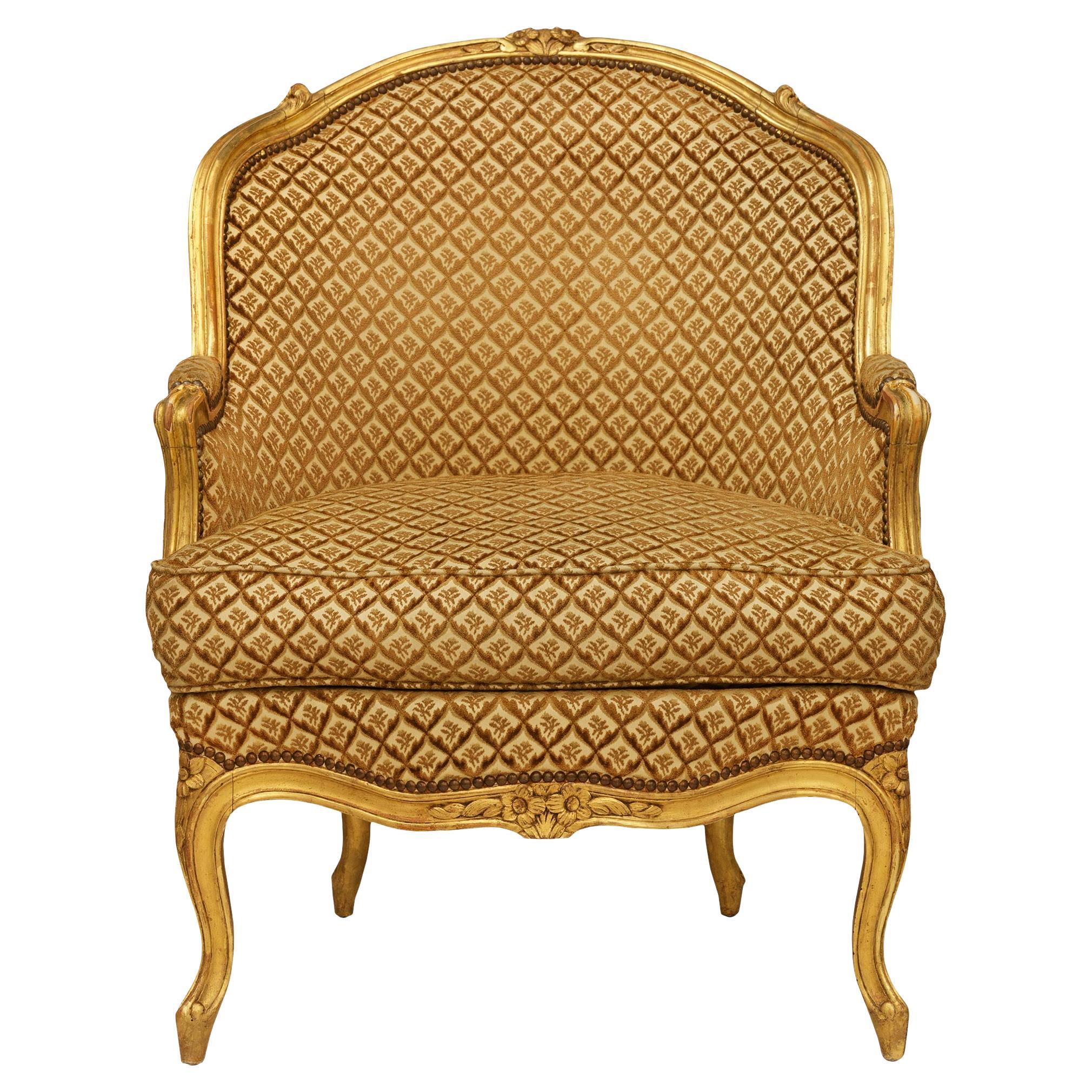 Poltrona Bergère francese della metà del XIX secolo in legno di gilt, stile Luigi XV