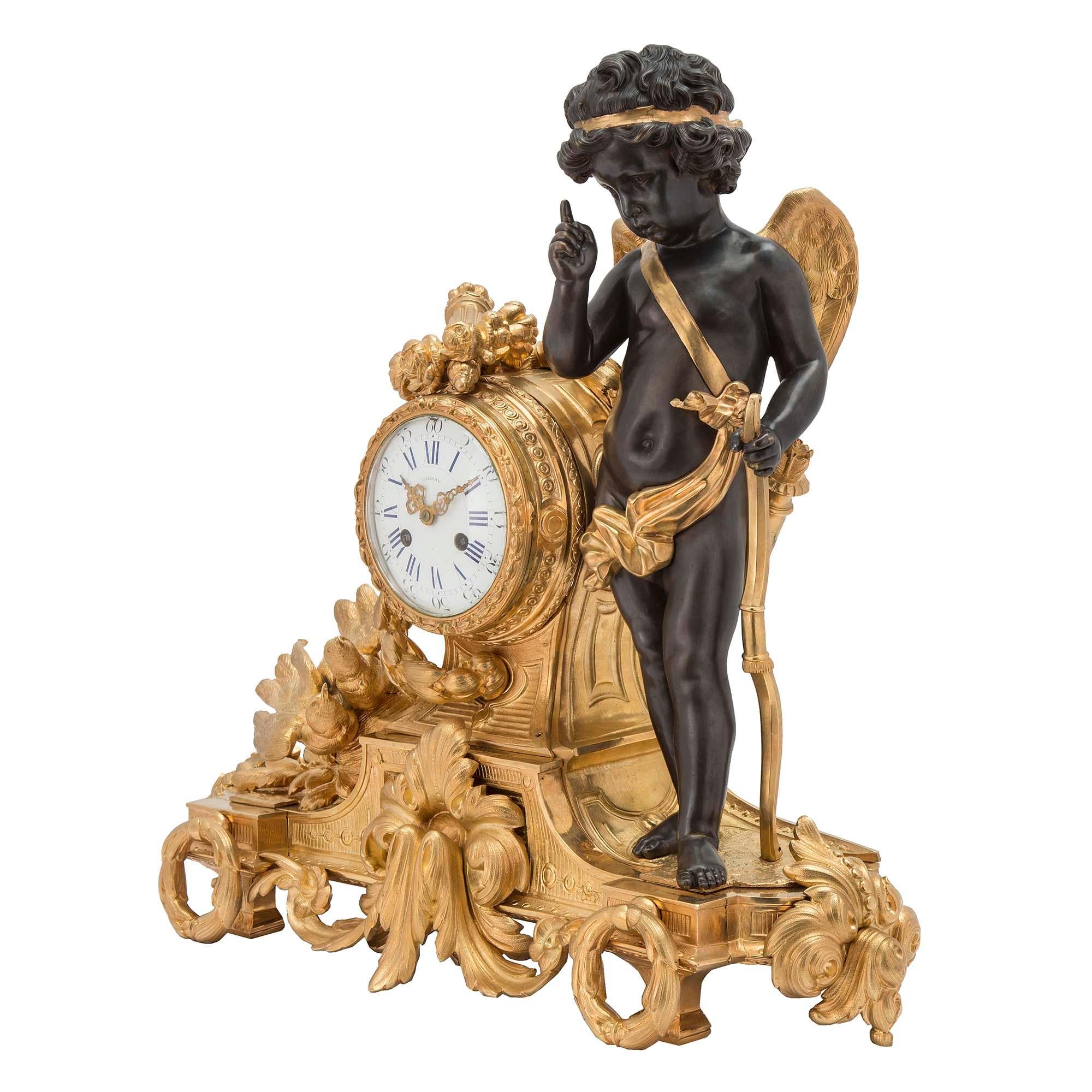 A stunning French mid 19th century Louis XVI st. ormolu clock, by Bardon, Montpellier. The clock has two love birds on the left looking over to a patinated bronze cupid, standing proudly with his bow. The enameled dial is raised on a heavily chased