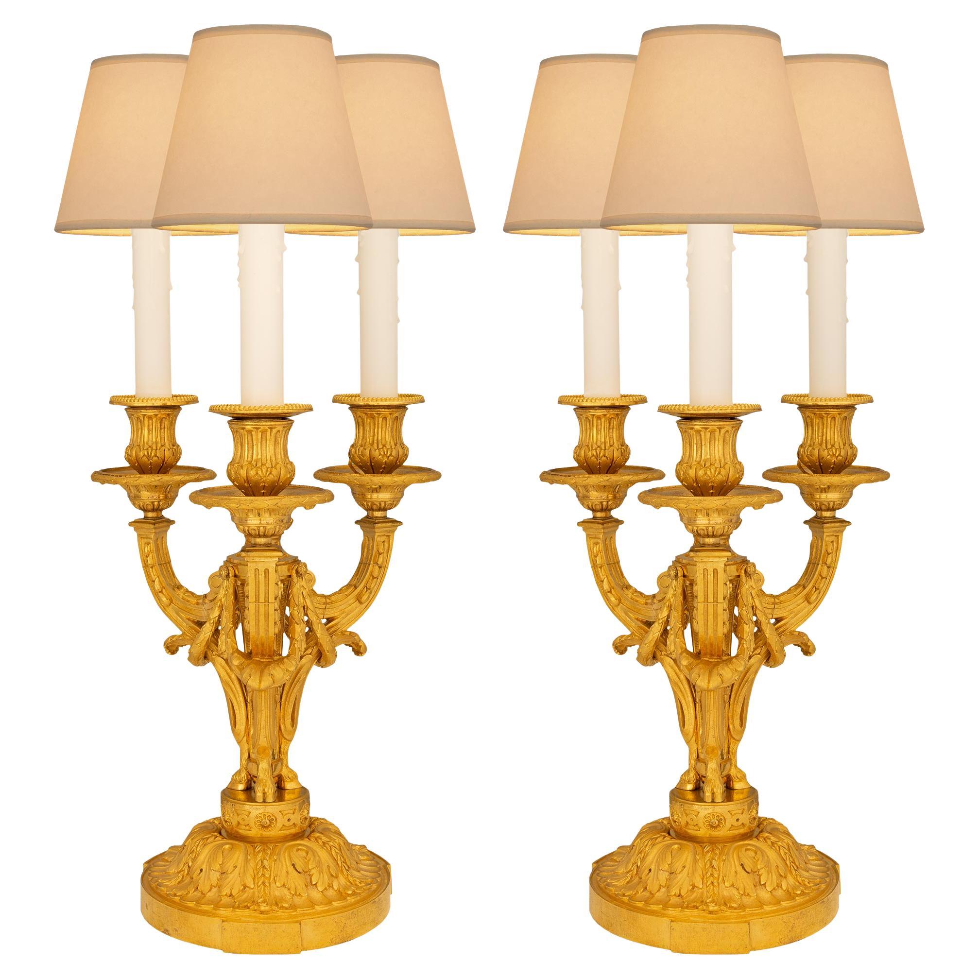 French Mid-19th Century Louis XVI St. Ormolu Three-Light Candelabra Lamps For Sale