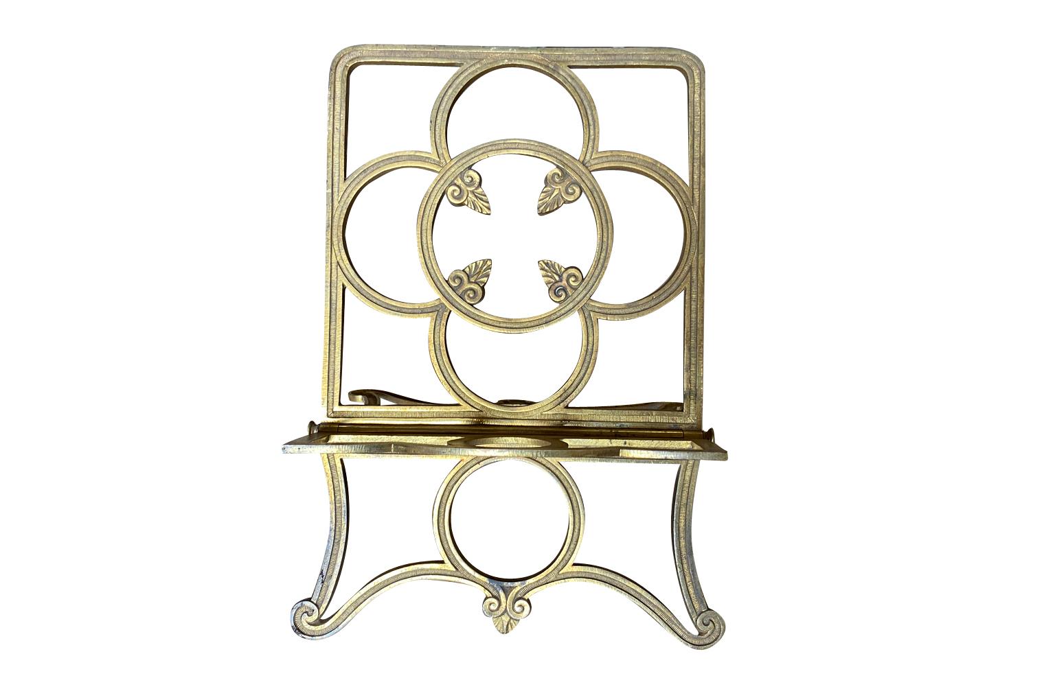 A very charming mid-19th century Porte Livre- Book Stand beautifully crafted in gilt bronze iron.  Perfect not only for the display of a book or a bible, but also for the display of a small painting.