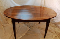 French Mid-19th Century Provincial Cherry Oval Dining Table with Tapered Legs