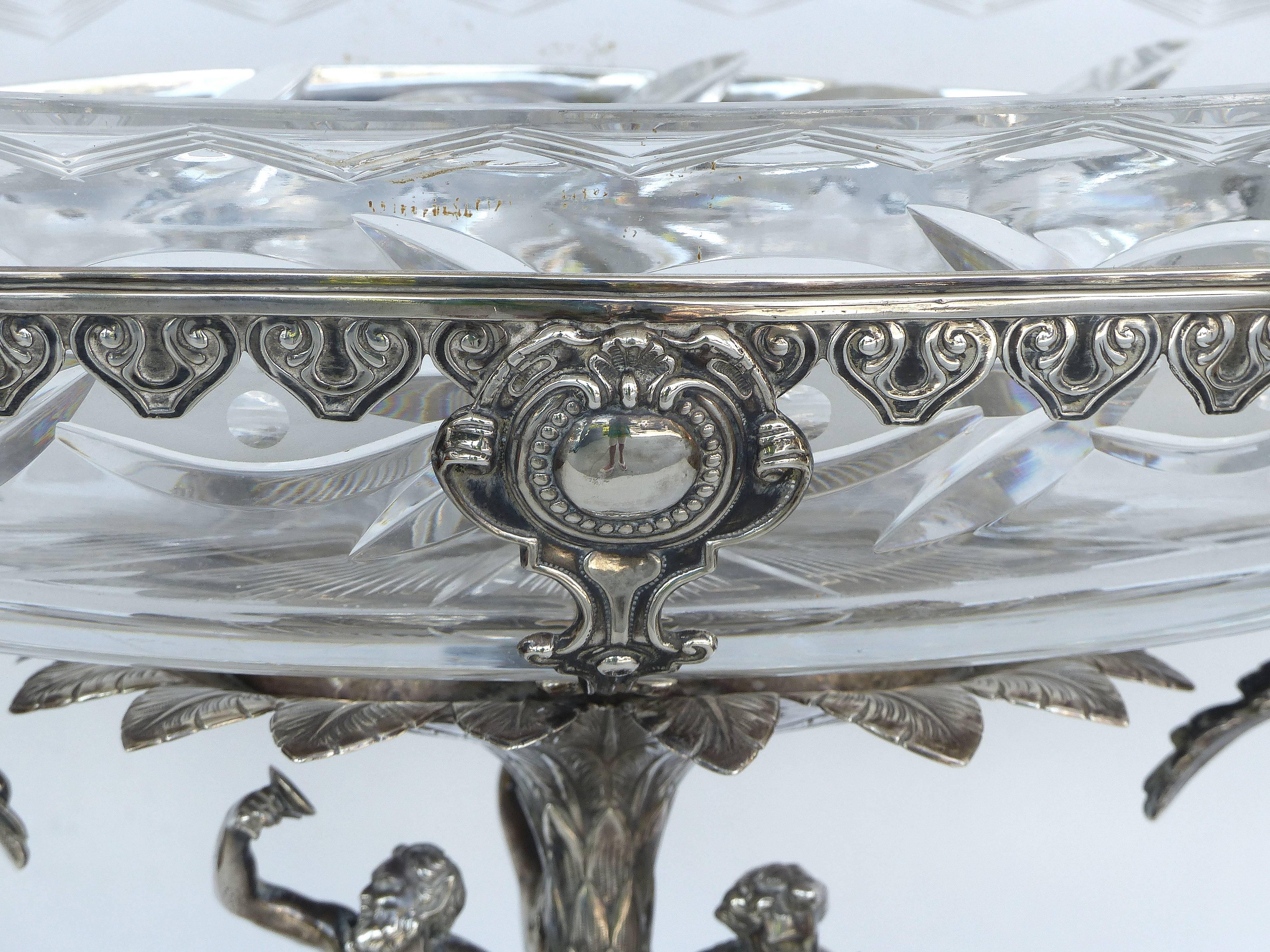 French Mid-19th Century Sterling Silver Centrepiece

Offered for sale in a French mid-19th century sterling silver centerpiece with a hallmark dating to 1840-1870 and a bacchanal theme with figures of a satyr. The cut crystal bowl is chipped and may