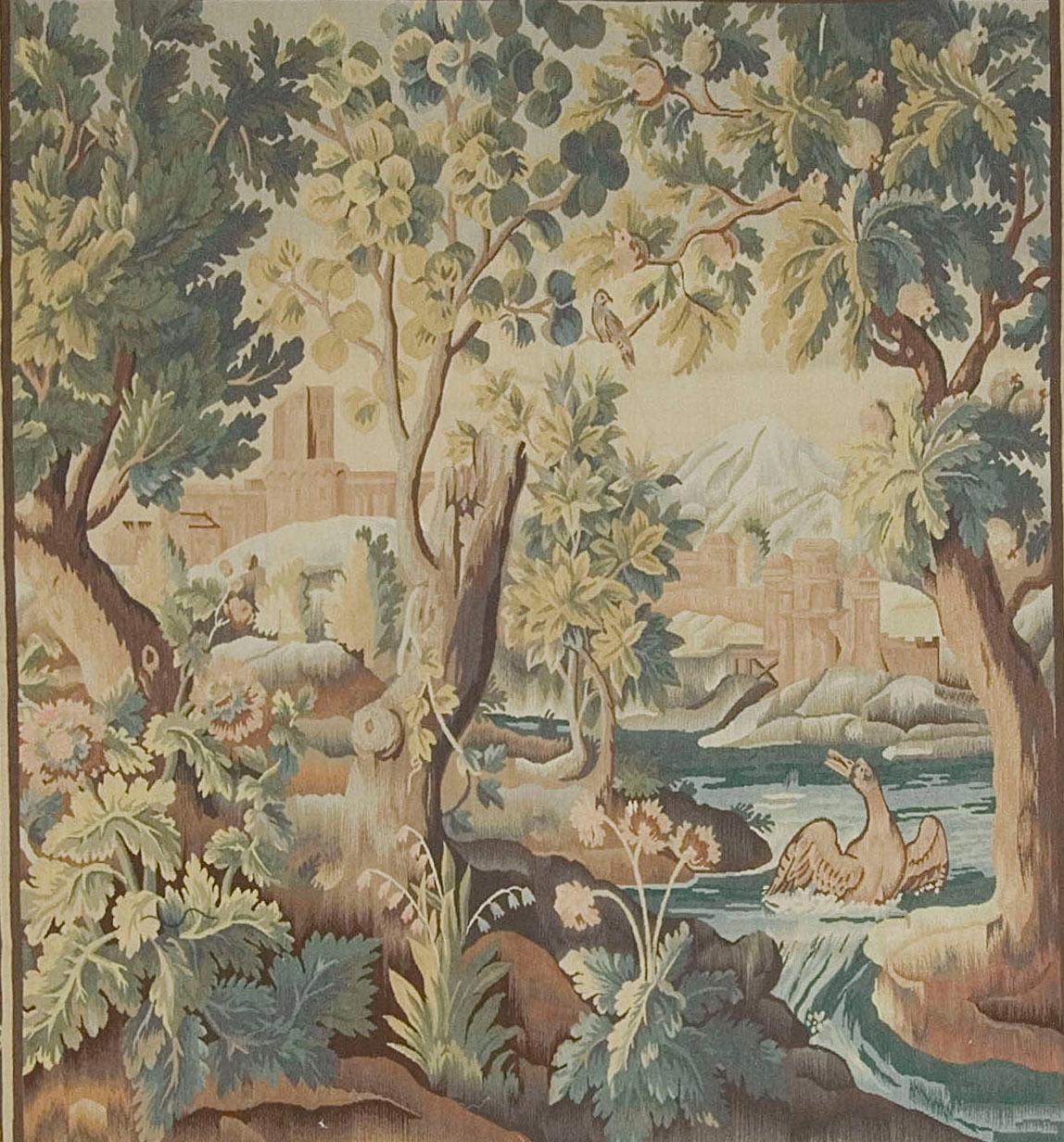 6'3 high x 5'9 wide. A circa 1880 hand-woven French Tapestry depicting a forest scene with a lake flowing through. and a bird in the water.