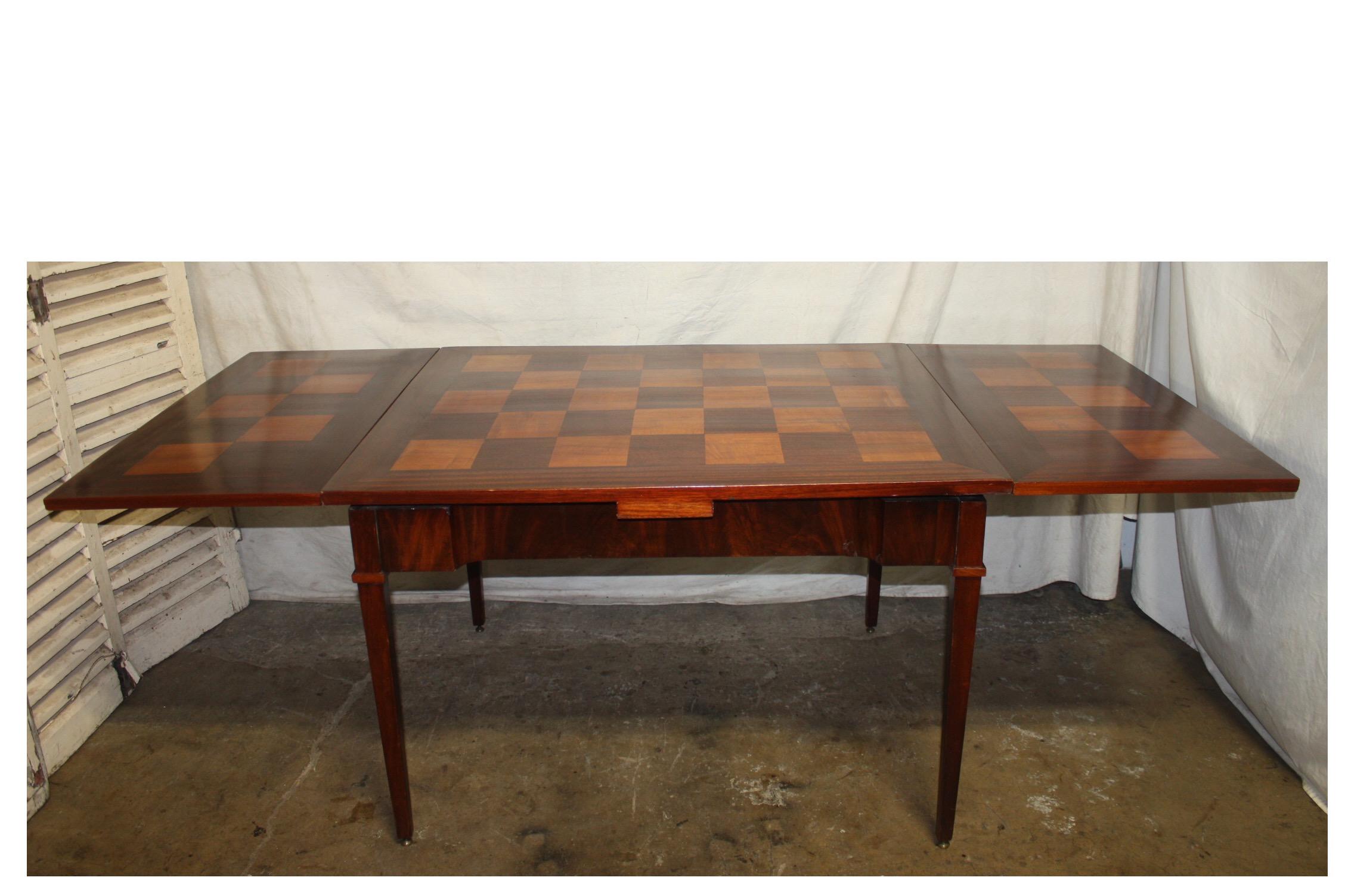 French mid-20th century game table or dining table.
Table opened 79.5in. W x 37in. D x 28.75in. H
Table closed 42.75in. W x 37in. D x 28.75in. H.
 