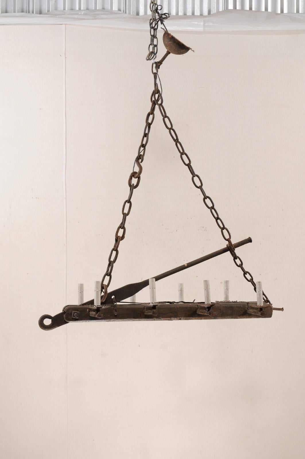 Rustic French Mid-20th Century Long Wood Beam and Iron Eight-Light Chandelier For Sale