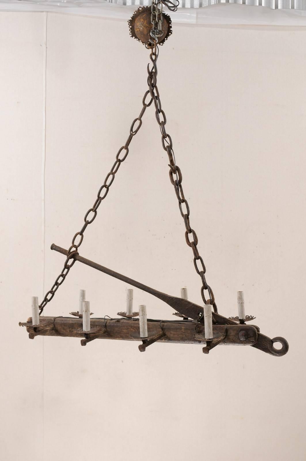 Carved French Mid-20th Century Long Wood Beam and Iron Eight-Light Chandelier For Sale