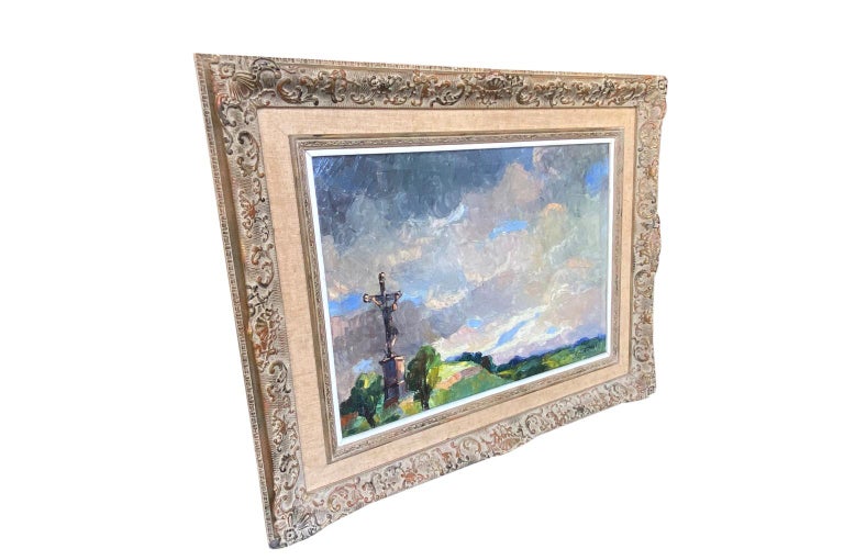 A very beautiful French early to mid-20th century Oil On Canvas painting of a Calvaire - a crucifix on a hillside in the Normandy countryside. Signed L. Lecomte. Stunning stormy sky. Fabulous light, color and brushwork. Housed in a lovely frame.