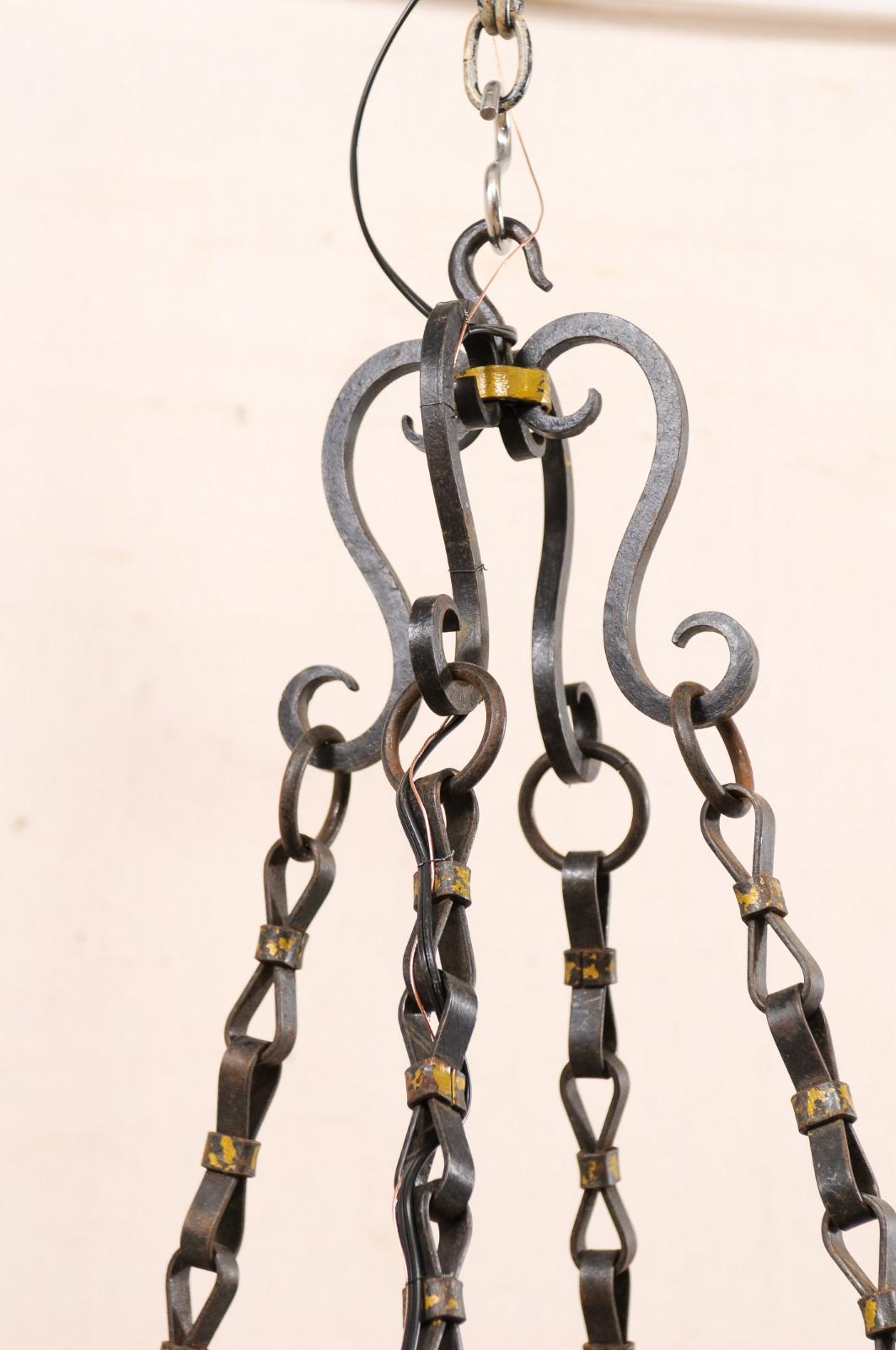 Metal French Oval-Shaped, 8-Light, Forged-Iron Chandelier with Gold Accents For Sale