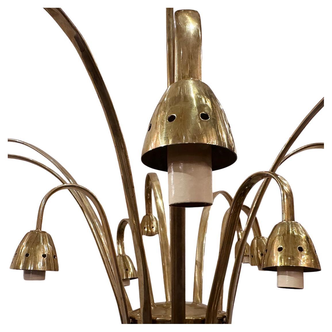 Lampadario in bronzo lucido francese del 1960 circa con 12 luci.

Misure:
Caduta attuale: 28
Altezza minima: 18