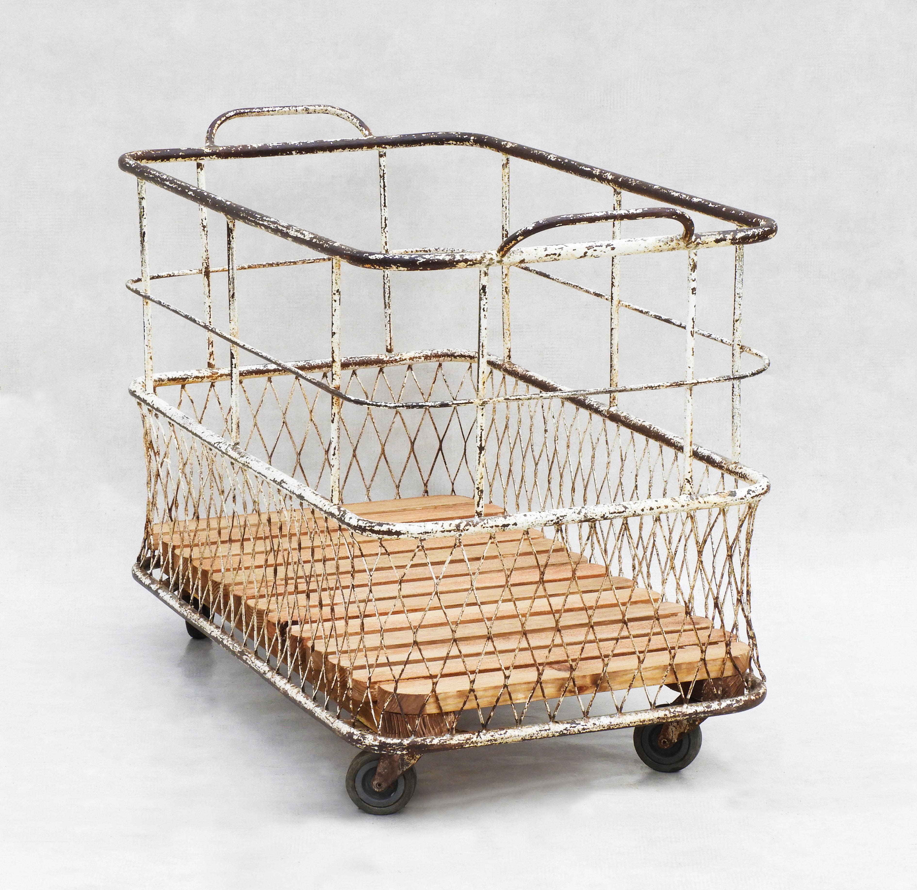 Large French baker's bread cart, provenance from a boulangerie in the southwest of France.  
Wonderfully distressed and full of character, this basket was used to carry the freshly baked baguettes from the bakery to the shop front. Versatile and